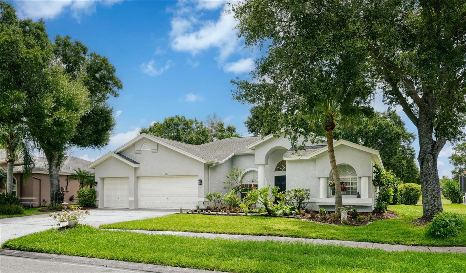 Virtually Staged. Located in the highly desirable Turnbury section of The Eagles, this beautifully updated single-story pool home offers a rare combination of space, comfort, and functionality within one of Odessa’s most sought-after guard-gated golf course communities. Deer, turkeys, and eagles are frequent visitors throughout the community, adding to the unique lifestyle The Eagles is known for. Spanning 2,748 square feet, this 4-bedroom, 3-bathroom residence with a 3-car garage features a thoughtfully designed layout with generous living spaces and a seamless flow ideal for both everyday living and entertaining. From the moment you arrive, the home showcases inviting curb appeal enhanced by updated lush landscaping (2026) and a well-maintained exterior that immediately sets the tone. At the heart of the home, the kitchen is both functional and welcoming, featuring Corian countertops, ample cabinetry, and an open connection to the main living areas. The spacious family room is anchored by a cozy fireplace, creating a warm and inviting gathering space, while large windows and sliding glass doors fill the home with natural light and provide effortless access to the outdoor living area.
The split-bedroom floorplan offers ideal privacy, highlighted by an oversized primary suite designed as a true retreat. The fully remodeled primary bathroom (2026) showcases updated tile work, quartzite (natural stone) countertops, a jetted soaking tub, and a spacious walk-in shower—blending comfort, style, and functionality beautifully. Throughout the home, you’ll find no carpet anywhere, creating a clean and modern feel. Recent updates include new lighting fixtures in the interior and exterior, new interior ceiling fans, updated flooring throughout most of the home (2026), including waterproof luxury vinyl flooring in the main living areas, adding both style and durability. Key UPDATES such as NEW Roof (2018) and NEW AC (2025) are in place for peace of mind! Step outside to your private pool and covered lanai with NEW coating (June 2026), the perfect setting to relax, entertain, and enjoy Florida living year-round. Combined with a spacious 3-car garage and an ideal single-story layout, this home truly checks all the boxes. Residents of The Eagles enjoy an unmatched lifestyle with two public championship golf courses, tennis courts, basketball courts, pickleball, a playground, and 24-hour guard-gated security, all surrounded by beautiful natural scenery and abundant green space. Zoned for A-rated schools on the Excellence List - Mary J. Bryant Elementary, Farnell Middle School, and Sickles High School - with low HOA fees and no CDD, this community continues to stand out as one of Tampa Bay’s premier neighborhoods. A rare opportunity to own a beautifully updated single-story pool home in one of the most desirable sections of The Eagles.