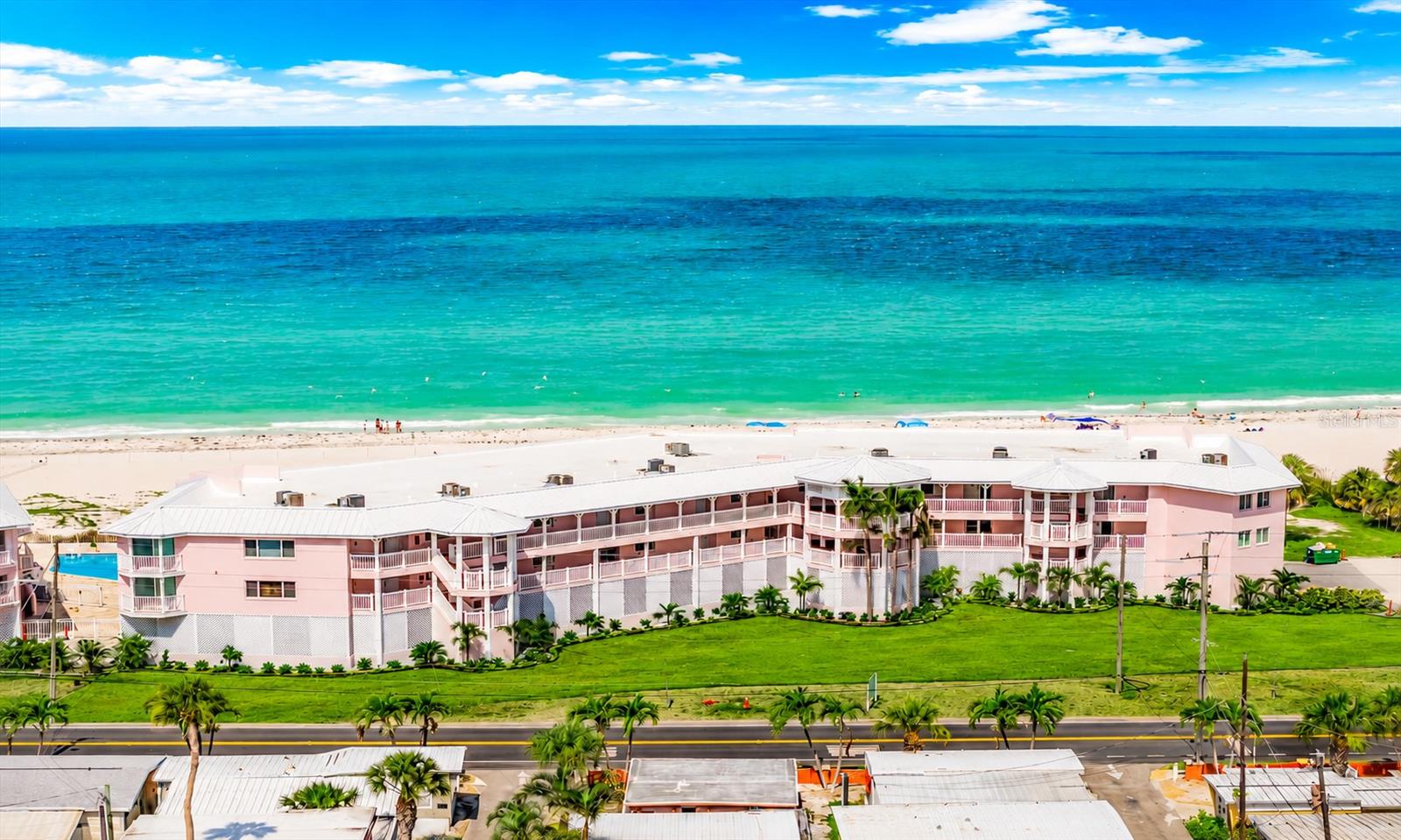 Experience the ultimate beachfront retreat at the "ANNA MARIA ISLAND CLUB" where LOCATION IS EVERYTHING AND THE GULF VIEWS ARE STUNNING! This exceptional 2B/2B ISLAND PARADISE condo offers bi-weekly rentals and is just steps away from the pristine sandy beaches of Anna Maria Island. This fully remodeled unit is a true gem, with a unique design is offered TURN-KEY furnished option and creates a welcoming and stylish ambiance. From the moment you step inside, you'll be captivated by the awe-inspiring panoramic views of the Gulf, providing a daily dose of breathtaking sunsets and a constant connection to the beauty of the sea. This unit offers a luxurious and comfortable living space, but it's Bradenton Beach NORTH location adds to its appeal. The beach, charming shops, and delightful restaurants are all within a hop on the free island trolley. SALT restaurant and Circle K are just across the street! Key features of this beachfront oasis include NEW paint, new Kerastan carpet in bedrooms, Newly furnished, Updated white shaker kitchen cabinets and granite countertops in kitchen and bathrooms. One car covered parking space and plenty of guest spaces. With the flexibility of weekly rentals allowed, this condo provides an excellent opportunity for those looking for an investment property or a part-time residence. Don't miss the chance to make this beachfront condo your own and experience the epitome of coastal living. Embrace the sun, sea, and sand – your dream home awaits! Note: The pool AND travertine pool deck and both roofs are all brand new since the hurricanes in 2024. Rental projections  of $114,000-132,000 are based on a few active rental units currently rented in this complex with local Seabreeze Vacation Co.