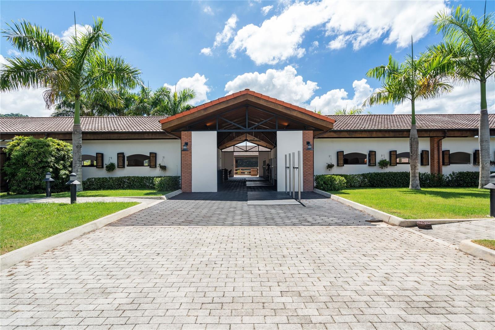 Welcome to the legendary Hacienda ‘La Nube’, a slice of heaven amongst the lush green mountain landscape of Puerto Rico. This picturesque ranch with more than 12,000 square feet of construction is located in the municipality of Morovis, the central region of the island. The serenity and seclusion it offers, and its masterfully bespoke design in complete synchrony with nature, makes this distinct Hacienda truly remarkable. 

Sitting on 53 acres of land and naturally irrigated by waterways, the Hacienda rewards its guests with its tranquil atmosphere, its pleasant climate and its astounding views from every angle. The Hacienda includes five luxurious and fully equipped 1 bed/1 bath lodges each with its own balcony, kitchenette, living and dining areas, all in a 483 SF open concept layout with floor-to-ceiling glass walls for guests to enjoy the every-changing canvas of colors showcased by the pristine verdant landscapes and vast azure sky.  

Towards the heart of the Hacienda you will find the grand central atrium, fully equipped with a state of the art outdoor kitchen, full bar, storage area, half bath and numerous open spaces to admire the dazzling sunsets in good company, host memorable intimate gatherings or large unforgettable events. On the top of the hill guests can enjoy the modern outdoor pool perfect for a morning swim or to relax in the afternoons, a sizable fire pit area ideal to play campfire games, share stories with your loved ones and eat homemade dinner by the fire. 

Hacienda ‘La Nube’ has an array of amenities including top-of-the-line stable facilities with capacity for 20 horses, a training ring, and a “Paso Fino” track. A variety of farm equipment, water cistern and a full power generator as well as parking for 20+ cars.

Nested in the town of Morovis is Las Cabachuelas Natural Reserve, a system of more than 60 caves full of archeological treasures studied by numerous international research organizations. ‘La Nube’ is situated just five minutes away from downtown Morovis, home of some of the finest eateries and bars of the central region. A convenient one-hour drive to the Luis Munoz Marin International Airport in San Juan makes ‘Hacienda La Nube’ a top destination in Puerto Rico. 

An entertainer’s dream, the possibilities of this Hacienda are endless. Great potential for a luxury boutique agro-tourism hospitality undertaking, a luxury wellness mountain retreat, a Bed & Breakfast or a unique vacation rental property. Act 60 tourism tax exemptions and credits are available. 

This is a prime opportunity to make your countryside living dream a reality.