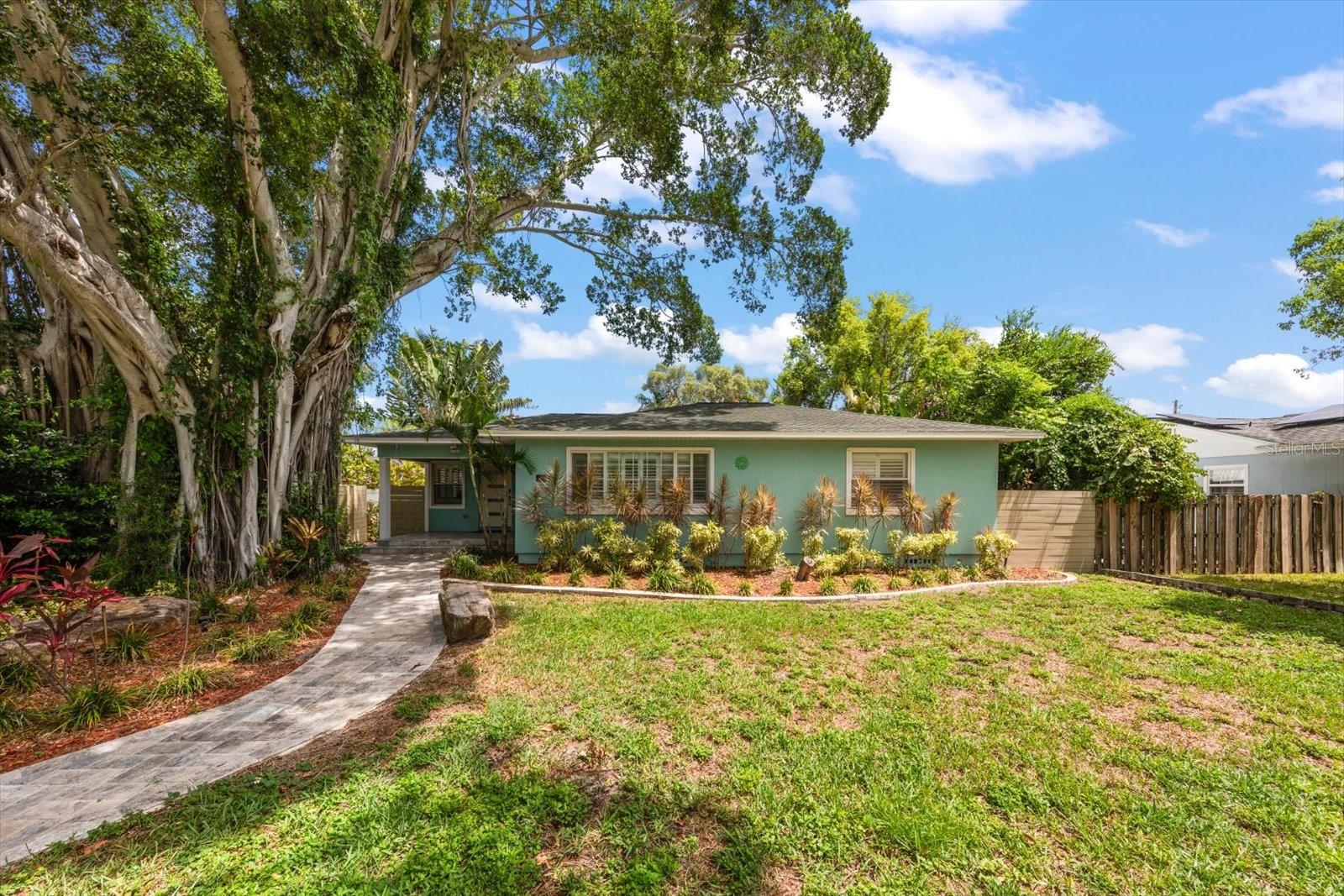 OWN A PIECE OF ST. PETERSBURG HISTORY
Welcome to the famous Banyan Tree Home — a property that embodies everything great about this incredible city. Steeped in local charm and completely renovated inside and out, this home seamlessly blends historic character with modern living.
Featuring 3 bedrooms and 2 bathrooms, this home offers generously sized rooms throughout, giving you plenty of space to spread out and make it your own. The amazing kitchen — fully redone in 2021 — flows effortlessly into the living room, creating the perfect open-concept space for everyday living and entertaining.
Step outside to your private retreat: a screened-in porch complete with TV and outdoor kitchen, ideal for hosting family and friends year-round. The fully fenced backyard offers privacy and peace of mind, with convenient alley access and parking to complete the package.
This is a rare opportunity to own a home that offers the best of both worlds — modern upgrades paired with the timeless nostalgia of historic St. Petersburg. Homes like this don't come around often.
Make this piece of St. Pete history yours today.