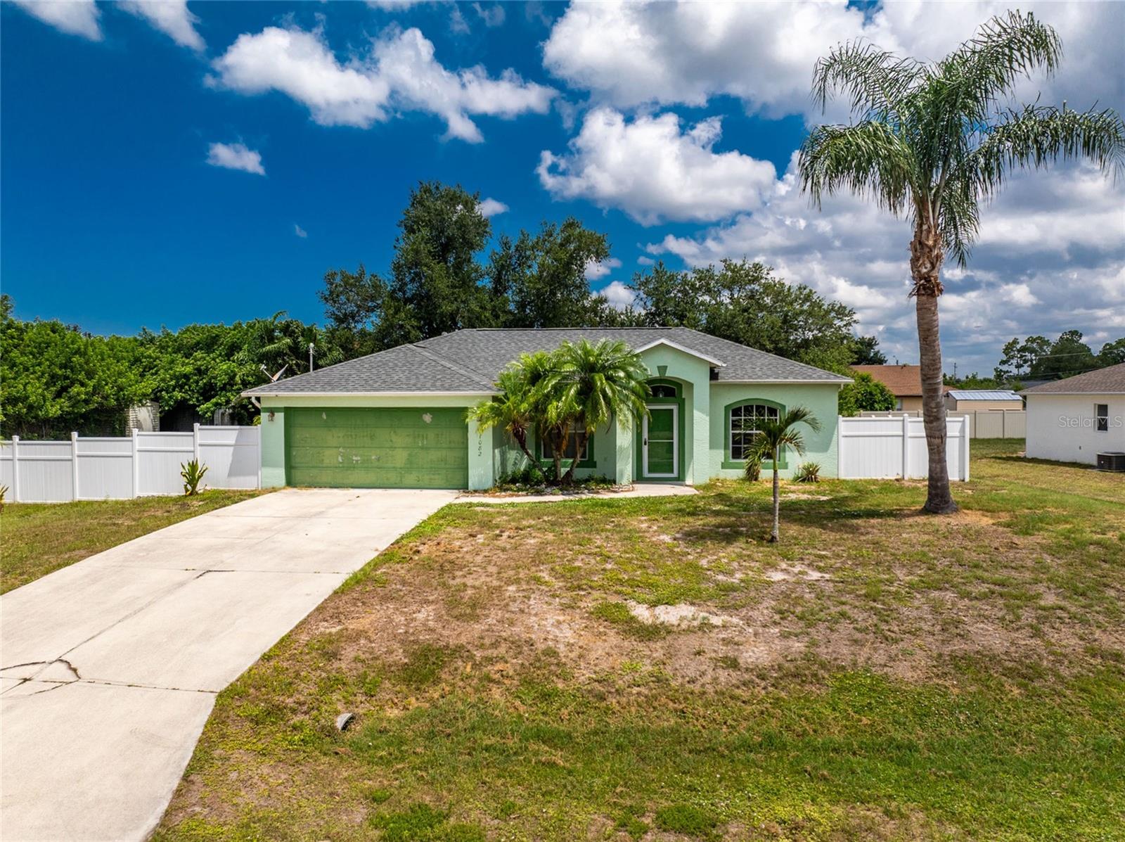 Hard to find Englewood East home with over half an acre of land, extra privacy, and plenty of room for all your toys. This property is located in an X flood zone, so flood insurance is not required. The home sits on one oversized lot, with a second oversized lot included next door, creating one large combined homesite with the space and flexibility buyers are looking for. Even better, there are no HOA fees and no deed restrictions, giving you more freedom to use the property the way you want. The fenced area surrounds the home and provides excellent privacy, while the extra side yard gives you space for boats, trailers, golf carts, equipment, pets, gardens, or simply more room to enjoy without everything being visible from the street or neighboring properties. There are also two sheds for additional storage.
Inside, this split floor plan home offers 3 bedrooms, 2 bathrooms, a 2 car garage, and an open layout with both a living room and family room. The kitchen is centrally located between the main living areas and features new kitchen cabinets, stainless steel appliances, recessed lighting, and plenty of space for everyday living or entertaining. The current setup includes a large walk-in pantry area, but this space was originally designed as an interior laundry room, so it could easily be returned to that use if it better fits your needs.
This home has had several important updates over the years, including a new roof in 2023, AC in 2016 with additional vents added for better airflow, recessed lighting throughout the home, updated lighting and ceiling fan features, vinyl flooring in most areas, new kitchen cabinets in 2025, new dishwasher in 2025, hurricane impact French door in 2025, new lanai screens and some new window screens in 2025. Additional improvements include a screened/glass front door, ceiling fan on the lanai, updated bathroom light fixtures, exterior spotlights for the backyard and side lot, garage door keypad, and a water heater replacement.
French doors lead to the backyard, and sliders from the family room open to the large screened lanai. The lanai overlooks the spacious backyard and gives you a great place to relax, entertain, or enjoy the Florida weather. The side lot was cleared, giving the property even more usable space and making the extra land one of the biggest selling features of this home.
This home is in a convenient Englewood location with easy access to local shopping, dining, golf courses, boating, fishing, and the beautiful Gulf beaches. With over half an acre, a fenced yard, two sheds, no deed restrictions, no HOA fees, and valuable updates already completed, this property offers the kind of space and flexibility that is getting harder to find. Schedule your showing today and come see how much potential this oversized Englewood homesite has to offer.