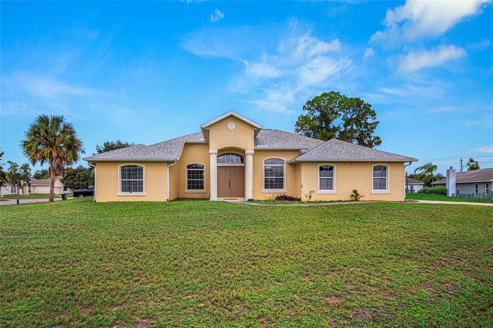 CORNER LOT!!!! Come take a look at this Move in ready spacious 3 bedroom, 2 bath, 2car garage home on a large corner lot. This property also has very lovely screened in porch. Roof (2021), AC (2017), Water Heater (2025), Move in and make it your own! Sewer and city Water. Lawn irrigation well dug and in place just add sprinklers! So close to shopping and restaurants, just 1 hour to Orlando and minutes to our Gorgeous Space Coast Beaches! Come take a look today!!