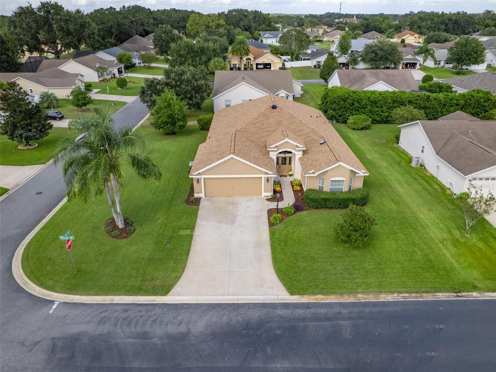 Welcome Home to this beautiful spacious corner lot house! Offering enough space for a pool that can be fenced in!
Location: The home is located in Bison Valley, which is an all-age community with access to The Villages, and the many amenities in Oxford, FL, including charter schools, medical facilities, banks, restaurants, shopping and many other resources, and entertainment options, makes it an even more appealing place to live. 
Size: The single-family home is approximately 2,517 Sq Ft under heat and AC.
Features: The house boasts 4 bedrooms, 2 baths, 2 car garage, an oversized lanai, 8'- and 10'-foot vaulted ceilings, elegant arched entryways, an oversized indoor laundry room (washer and dryer included) with built-in desk for an office, and extra cabinetry.
Kitchen: The kitchen is open-concept with recessed lighting, newer fan, and eat-in accommodations. It includes ample cabinetry and stainless-steel appliances.
Garage: There's a two-car garage with a golf cart included and the capability to charge an electric vehicle with a 50-amp outlet (excluding the plug).
Additional Features: The house features double-pane windows, two solar fans, an attic for additional storage, and elegant bamboo flooring, throughout most of the home including the master bedroom. The roof was recently replaced in 2022 and comes with a warranty and it is a mold resistant roof. The appliances are only 5 years old, while the washer and dryer are only 3 years old.
Master Bedroom and Bathroom: The master bedroom has a walk-in closet, and the master bathroom includes his and her vanities and a walk-in Roman-style tiled shower with a bench.
Curb Appeal: The home is situated on an oversized corner lot with beautiful landscaping. In this community you are allowed to put a fence on your back yard for your furry friend(s), pet friendly community.
Optional Furniture Package: There's an optional furniture package available, with a list provided upon request. 
Please enjoy the pictures and virtual slide show.  
Contact me today to schedule a personal showing or a custom virtual tour to experience the feel and look of this comfortable home here in Bison Valley.