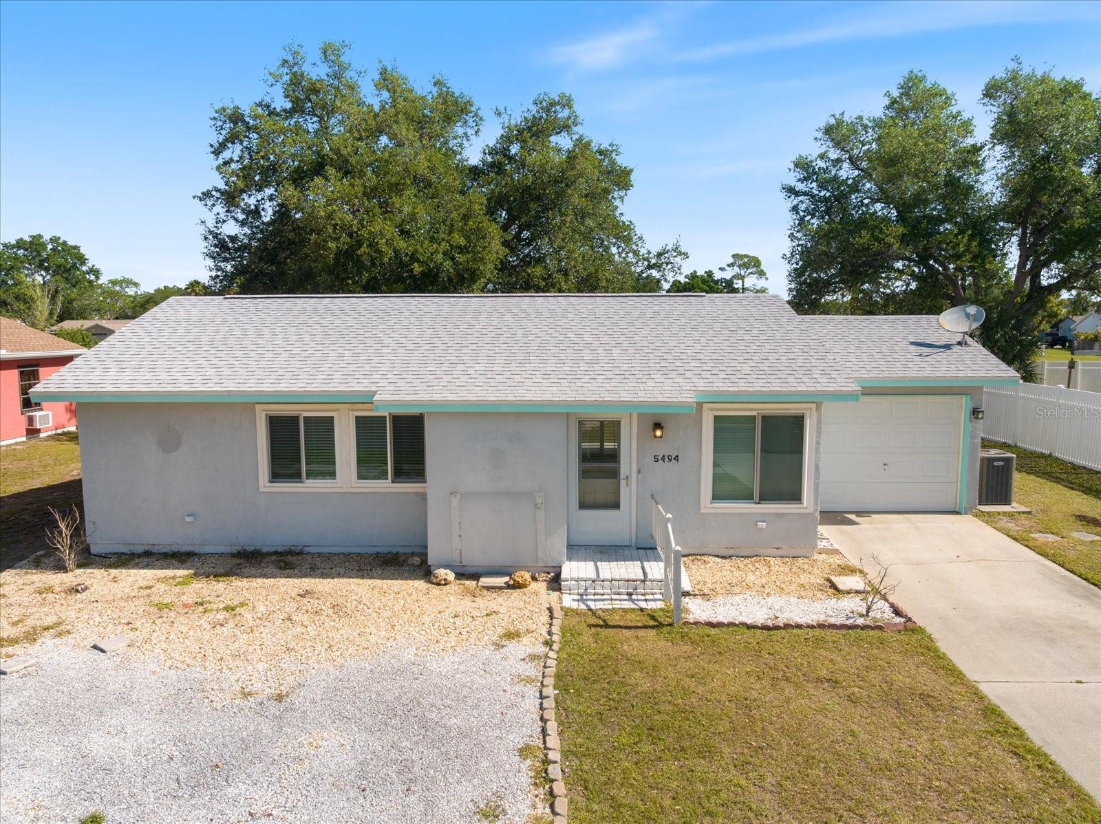 Well-maintained and move-in ready, this 2-bedroom, 2-bath home offers a clean, functional layout with durable finishes throughout. Featuring porcelain tile and vinyl flooring, the interior provides low-maintenance living with a cohesive, updated feel.

The home sits on an oversized 0.22-acre lot, offering ample outdoor space and flexibility for future use. A one-car attached garage and extended driveway provide convenient parking and storage options.

Major systems include central air and electric heating, with public water and sewer services in place. The property is located on a paved street with sidewalks, contributing to both accessibility and neighborhood appeal.

Positioned in an established North Port location with no HOA fees, the home offers easy access to local schools, shopping, and major roadways while maintaining a quiet residential setting.

Ideal for primary residence, seasonal use, or investment, this property presents a straightforward opportunity with solid fundamentals and room for personalization.