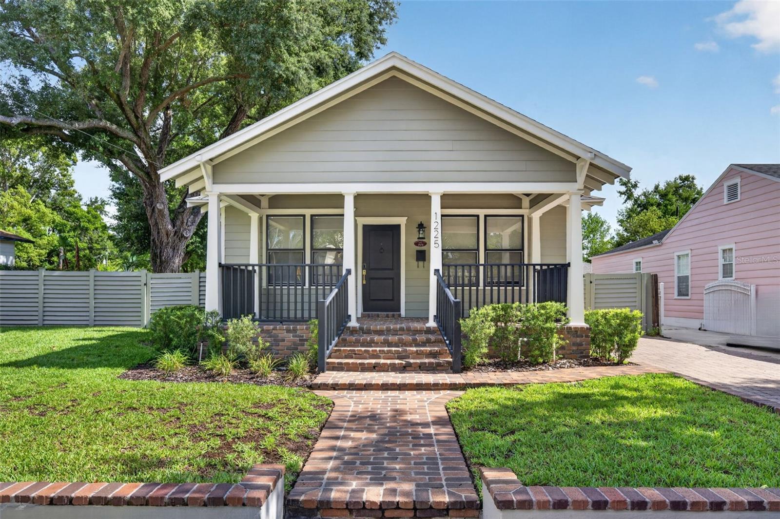 Charming, updated 3-bedroom, 2-bath bungalow in the heart of Downtown Orlando! This light-filled home features luxury flooring throughout, an open floor plan, updated kitchen and baths, and a laundry closet with a brand-new washer and dryer. Enjoy the spacious front porch, oversized fenced backyard, and large paver parking area with plenty of room for cars. Conveniently located near Lake Eola, Thornton Park, Mills 50 dining and shopping, and directly across from the YMCA. A rare opportunity to enjoy downtown living. Lawn care is included.