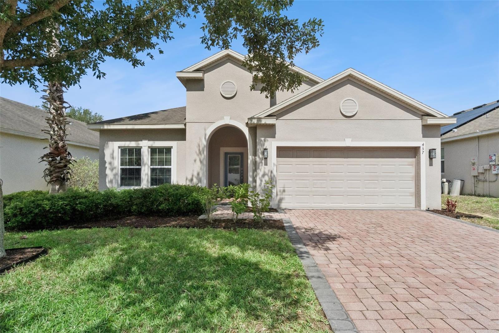 Offered within the gated enclave of Bridgeford Crossing, this turnkey four-bedroom, two-bath residence presents a rare dual opportunity, a polished primary residence or an income-generating short-term rental in one of Central Florida's most sought-after investment corridors. Situated on an oversized 0.23-acre lot, the single-story block home delivers 1,864 sq ft of thoughtfully designed living space with modern finishes throughout. The open-concept interior features tile flooring, abundant natural light, and a well-appointed kitchen with stainless appliances, granite countertops, center island, modern backsplash, and pantry. The dining area flows to a covered lanai. Interior laundry and two-car garage included. Community amenities include clubhouse, resort pool, fitness center, tennis courts, park, and playground all within a gated community.  Sold fully furnished and turnkey as an active STR. Rental performance data available upon request. Minutes to Disney, I-4, Hwy 27, and Southern Dunes Golf Course.
