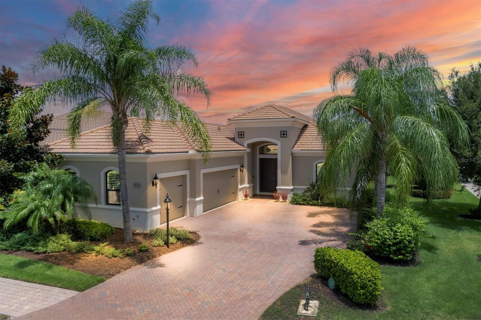 One or more photo(s) has been virtually staged. LUXURIOUS NEAL SIGNATURE home offering the BEST SQUARE FOOT PRICE IN HADDINGTON OF LAKEWOOD RANCH COUNTRY CLUB EAST, an exceptional value! OPEN CONCEPT design, perfect for indoor and outdoor living, creates an inviting atmosphere for family gatherings, entertaining friends or enjoying personal relaxation in an INTIMATE & PRIVATE OUTDOOR SETTING. The SECLUDED POOL GROTTO is enhanced by a NEW MURAL POOL SCREEN adding a refined visual and artistic element that elevates the outdoor space. The architectural design optimizes the corner site welcoming you to a light filled Great Room with pocketing slider and Dine-in Kitchen overlooking your sparkling HEATED SALT WATER POOL and unique CORAL STONE PAVER LANAI, added in 2022, along with convenient Pool Bath access. The ultimate entertaining space features expansive single level island, wood cabinets with crown molding, roll out shelves, under cabinet lighting, gleaming granite countertops and GE Cafe Stainless Steel Appliances. A separate formal dining room is ideal for your special occasions. Refined interior finishes include neutral décor, tray ceilings, crown molding, custom decorative inset shelves, 10' and 12' ceilings, 8' doors, tile, updated luxury vinyl floors in all bedrooms, built-in closets and PLANTATION SHUTTERS. The owners suite serves as a retreat providing outdoor access to the lanai and pool, dual built-in closets, split vanities, roomy walk-in shower, separate soaking tub and private water closet. The study provides versatile space for a home office, game room or hobbies, and the desirable split bedroom and bath design ensures privacy for family and guests with 2 additional bedrooms and full bath. Spacious Laundry Room features front load washer and dryer, upper and lower cabinets, drop-in utility sink and linen closet. The 3 CAR INSIDE LOAD GARAGE includes AIR CONDITIONED COMFORT for you, your specialty vehicles or golf cart, upgraded epoxy finished floor, storage cabinets, 2 hanging storage racks and insulated garage door. For your peace of mind, the home features a 2-stage 16 SEER HVAC with REMO HALO UV & AIR IONIZATION SYSTEM, insulated Low-E Windows, RADIANT ATTIC INSULATION, FOAM INSULATED BLOCK WALLS, a KOHLER 20KW NATURAL GAS GENERATOR. Front impact windows, storm shutters, tile roof, paver driveway, landscape lighting and 1 YEAR AMERICAN HOME SHIELD WARRANTY complete this wonderful home. This quiet sanctuary is a rare opportunity with endless possibilities. Relax in your private setting with maintenance free landscape, or take advantage of the recreational opportunities included in Country Club East. Amenities include the "Retreat" featuring Resident Clubhouse with gathering room, fitness center, resort style pool, and there's an additional clubhouse, 2 pools and spa within the community. Live in the spectacular Country Club East setting where golf, sports and social memberships are optional, located in the #1 Multi-Generational Community in the country. You will find boutique shopping and dining, farmer's market and an abundance of events at Lakewood Ranch Main Street and Waterside Place. This PREMIERE LOCATION is just minutes to recreational pursuits, shopping & dining at UTC Shopping Mall, Nathan Benderson Rowing Park, the new MOTE SEA Aquarium, I-75 to travel north and south and close proximity to SRQ Airport, downtown Sarasota's Bayfront, a multitude of cultural venues and our gorgeous Gulf Coast Beaches!