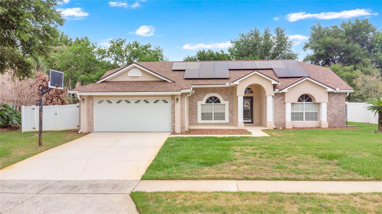 Welcome to this beautiful home located in the highly desirable Greater Pines community! This spacious 4-bedroom, 2-bathroom residence offers a functional floor plan with a versatile flex room that can easily serve as a home office, playroom, fitness room, or additional living area.

Numerous updates provide added value and peace of mind, including a new roof installed in May 2026, HVAC system and water heater replaced in 2022, and solar panels added in 2023 for enhanced energy efficiency. The primary suite features elegant French doors, while laminate flooring throughout the bedrooms adds warmth, durability, and easy maintenance.

The kitchen is equipped with stainless steel appliances, granite countertops, and ample cabinet space. Both bathrooms have been updated with granite vanities, creating a cohesive and stylish look throughout the home.

Additional highlights include a separate laundry room, convenient cabana bath with outdoor access, and an enclosed patio with luxury vinyl flooring and windows, providing the perfect space for year-round relaxation or entertaining.

Step outside to a large, fully fenced backyard offering privacy, security, and plenty of room for outdoor gatherings, pets, gardening, or future enhancements. This property combines comfort, functionality, and outdoor enjoyment.

Enjoy access to community amenities including a swimming pool, tennis courts, basketball court, playground, and recreation area. Conveniently located near shopping, dining, parks, major roadways, and top-rated schools, this home offers an exceptional opportunity to enjoy the best of Clermont living.

Don't miss your opportunity schedule a showing today!