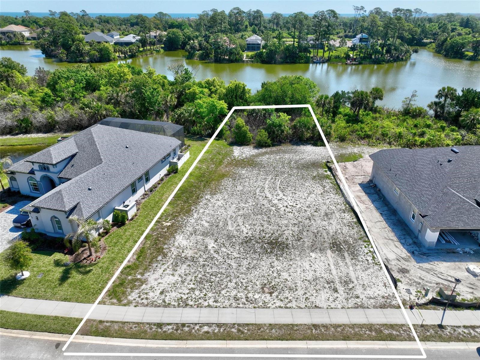 Build your dream home on this beautiful lakefront lot located at 128 N Lakewalk Drive in Palm Coast, FL. Boasting an impressive 89 feet of frontage, this property offers expansive water views and plenty of space to design a custom residence that takes full advantage of its serene setting....... SOIL TEST AND SURVEY ARE AVAILABLE ON FILE.
Situated in the desirable community of Palm Coast Plantation, the lot faces a peaceful preserve across the street, ensuring added privacy and a natural backdrop both front and back. Whether you’re enjoying sunrise over the water or the quiet beauty and added privacy of the preserved landscape, this homesite delivers a rare combination of openness and tranquility.
Residents of this sought-after neighborhood enjoy access to a variety of amenities, enhancing both lifestyle and convenience. Amenities included are: Large community pool, Tennis/pickle-ball courts, fishing dock on the Intracostal Waterway and storage for boats and RV's. With its prime location, generous frontage, and picturesque surroundings, this is a unique opportunity to create your ideal Florida retreat.
Don’t miss your chance to own a premium homesite in one of Palm Coast’s most sought after communities.