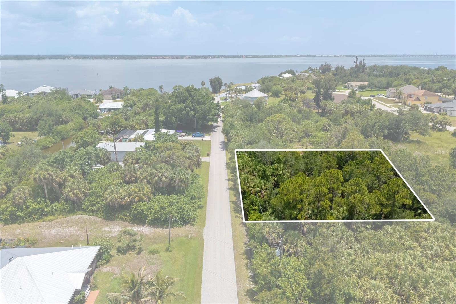Build your dream home on this exceptional offering in the heart of Charlotte Harbor! This unique property includes Lots 5 & 6 along with Boat Lot 5A located directly across the street. A survey is available and attached to the listing, and public water and sewer are nearby for future connection.

Nestled on a wooded homesite, you'll have the opportunity to create the custom home you've always envisioned while enjoying the privacy and natural beauty of mature trees. Buyers are encouraged to walk the property and experience its potential firsthand.

Included with the property is Boat Lot 5A, situated on a saltwater canal with access to the Peace River and Charlotte Harbor, offering outstanding opportunities for boating, fishing, kayaking, and enjoying Southwest Florida's waterfront lifestyle. The feasibility of constructing a boat dock and the navigability of the canal are unknown. Buyers are encouraged to conduct their own due diligence to verify suitability for their intended use.

Ideally located just minutes from Sunseeker Resort, Fishermen's Village, the Punta Gorda Harborwalk, historic downtown Punta Gorda, and downtown Port Charlotte, you'll enjoy convenient access to waterfront dining, shopping, entertainment, marinas, golf courses, parks, and everything that makes Southwest Florida such a desirable place to call home.

Whether you're looking to build your primary residence, a seasonal retreat, or an investment property, this rare package offers the flexibility, location, and lifestyle to bring your vision to life.