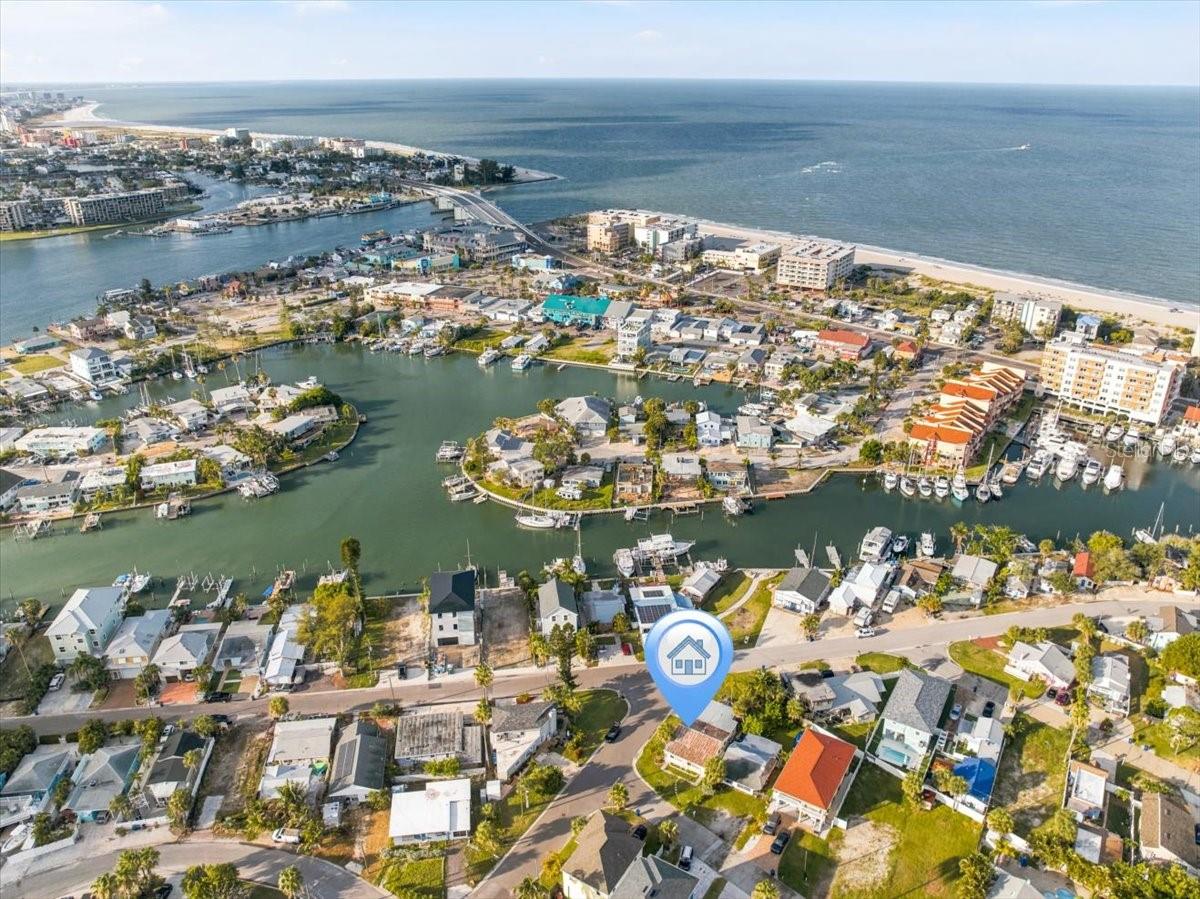 Location, location, location! Redevelopment opportunity with Intracoastal views in a prime Madeira Beach location. Just blocks from award-winning Gulf of Mexico beaches, Boca Ciega Bay, John’s Pass Village and Boardwalk, waterfront dining, shopping, and entertainment. This spacious lot is a perfect canvas for builders, developers, investors, or anyone looking to build their dream home. Current R-2 zoning offers potential for a duplex or triplex (variances may be required), or a large 5,000+ sq ft single-family home. Build your dream home in an unbeatable location or create multiple units for your investment portfolio. The surrounding area has strong short-term rental demand. Buyers should verify city ordinances and restrictions. Elevated construction is permitted for flood compliance. The existing home needs to be demolished, and a permit must be obtained by September 25, 2026. Don’t miss this incredible opportunity. Call today to schedule your private showing.
