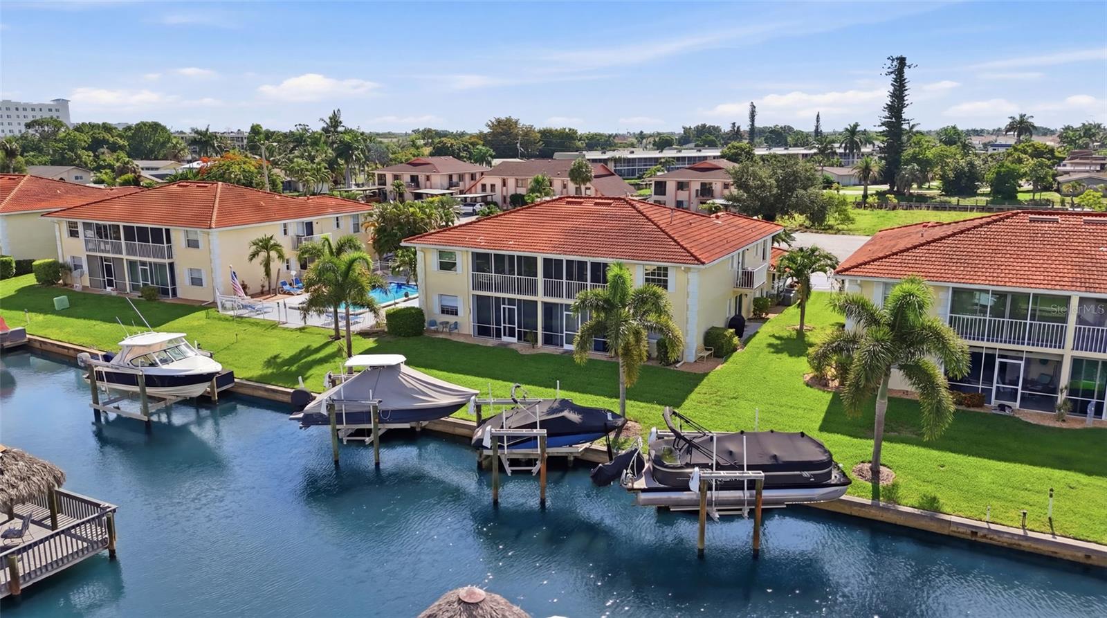 Why settle for ordinary when you can wake up to sparkling waterfront views, step aboard your boat, and be cruising to the Gulf of America within minutes? Perfectly blending sophisticated coastal design with an unbeatable boating lifestyle, this fully renovated waterfront condominium offers direct Gulf access and delivers the effortless Southwest Florida lifestyle you've been dreaming of. Offered FULLY FURNISHED, this exceptional residence was completely reimagined in 2021 with a stunning coastal-modern aesthetic, premium finishes, and thoughtful craftsmanship throughout. Sunlight pours into the spacious open-concept floor plan, where luxury vinyl plank flooring, designer lighting, and an airy palette create a warm yet refined living environment. The beautifully appointed gourmet kitchen serves as the centerpiece of the home, showcasing sleek custom cabinetry, premium stainless steel appliances, expansive countertops, and abundant storage—perfect for everyday living and entertaining alike. The spacious living and dining areas seamlessly transition to the private waterfront lanai and side porch, where breathtaking sunrises greet your mornings and vibrant Florida sunsets provide the perfect backdrop to unwind each evening. Every space has been designed to maximize the tranquil water views and coastal ambiance. Both generously sized bedroom suites offer private retreats with beautifully updated en-suite bathrooms featuring custom tile work, modern fixtures, and spa-inspired finishes. Additional upgrades include a newer HVAC system, an Everpure whole-home water filtration system, and countless custom enhancements that make this residence truly move-in ready. Boating enthusiasts will appreciate the community's direct Gulf access, with dock space available on a first-come, first-served basis, making spontaneous days on the water effortless. Ideally located just moments from Downtown Cape Coral, the Yacht Club Beach, Four Freedoms Park, waterfront dining, boutique shopping, entertainment, and vibrant local events, you'll enjoy one of the city's most desirable waterfront locations. Whether you're searching for a luxurious full-time residence, an elegant seasonal escape, or a turnkey waterfront investment, this impeccably renovated coastal condominium offers the perfect combination of modern luxury, direct Gulf access, and the relaxed waterfront lifestyle that makes Southwest Florida one of the nation's most sought-after destinations.