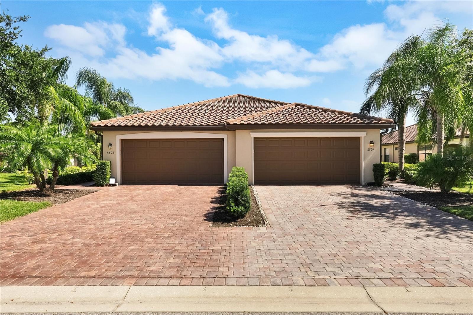 MOVE-IN READY.  Welcome to your easy living in Florida. This beautifully UPDATED maintained 2-bedroom, 2-bathroom Villa with an OFFICE/DEN and a 2-car garage offering style, and unbeatable value. SELLER Incentive: 12 Months of Villa I HOA ONLY prepaid at closing. Not to include any other HOA or CDD Fees.  Step inside and be greeted by a spacious, OPEN-CONCEPT layout ideal for both relaxing and entertaining. The living and dining areas flow effortlessly, while the kitchen features a nice breakfast bar. The Kitchen countertops have been updated with an ELEGANT GRANITE, and the cabinets were all PAINTED a GORGEOUS WHITE COLOR. Enjoy serene views of the pond, and nature from your patio and master bedroom.  Additional Highlights include BUILT-IN CUSTOM CABINETS in both Bedrooms, laundry room, office/den room , ceramic flooring in all rooms, NO Carpet !!! Ceiling fans throughout the home, sliding glass doors for refreshing cross-breezes, laundry room with full-size washer & dryer with extra storage, Garage upgrades include painted flooring, and added storage.  Located on the Sanctuary side of River Strand, you'll enjoy access to one of the largest community pools, a fitness center, hot tub, meeting room with kitchen, plus pickleball and basketball courts. As a social membership home, you'll have full access to all resort amenities - including the main clubhouse, on-site restaurant, Tiki bar & grill, resistance pool, tennis courts and more.  Golf lovers can take advantage of the 27-hole championship course designed by Arthur Hills with pay-as-you-play access. HOA includes lawn & sprinkler maintenance, Spectrum cable & high-speed internet for added convenience and savings. Located near the new Bradenton Market Place with Costco, Target, HomeGoods, ALDI, restaurants, and more! Easy access to I-75, Lakewood Ranch, Sarasota, Tampa, St. Pete, and Gulf Coast beaches. Don't miss your chance to own a slice of PARADISE. Schedule your SHOWING today!