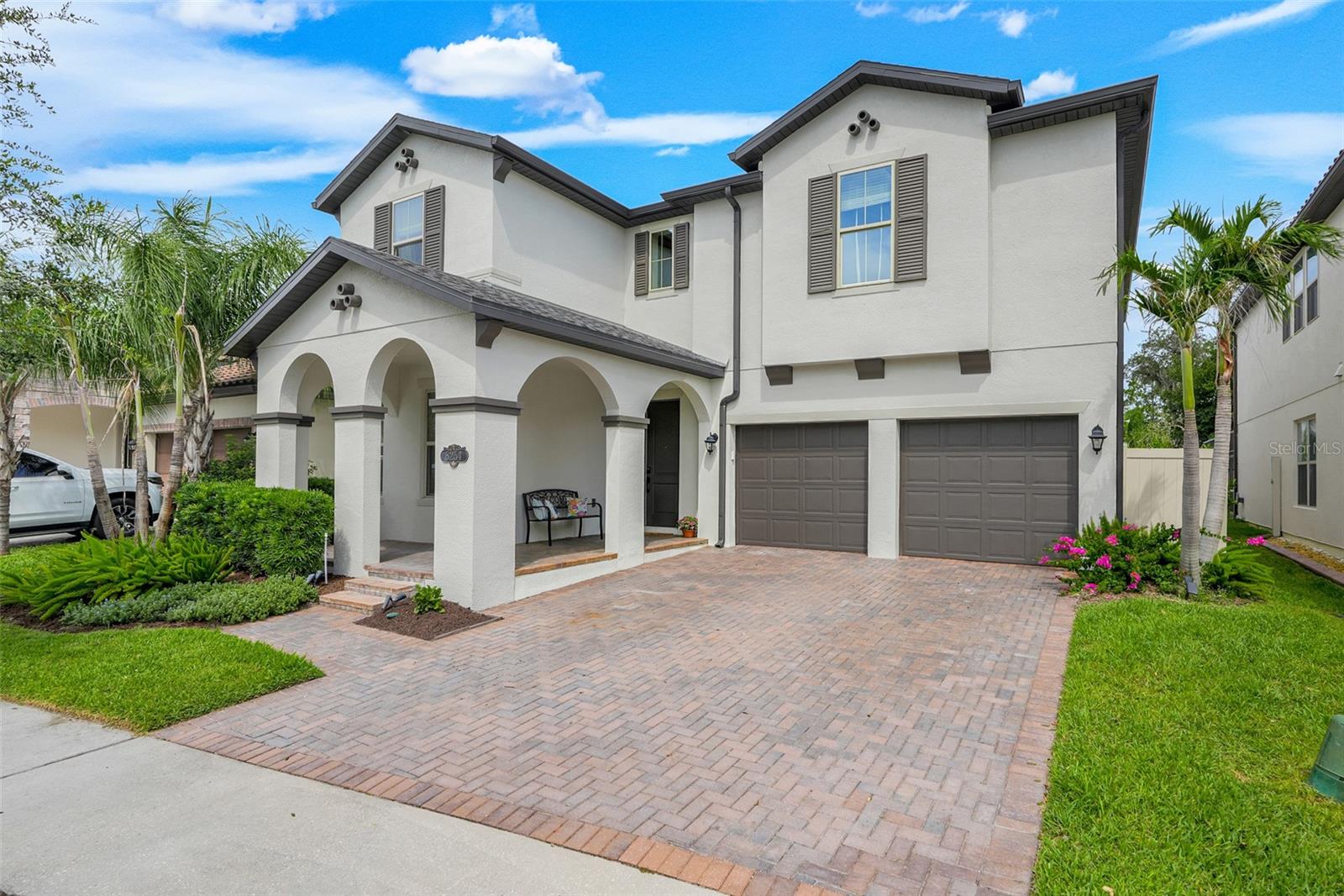 Experience the perfect blend of elegance, comfort, and modern convenience in this exceptional 5-bedroom, 4-bathroom home in the highly sought-after Windermere Isle community. Enjoy nightly Disney fireworks from the second floor! A charming covered front porch welcomes you inside, where the foyer showcases beautiful wood-look tile flooring that flows seamlessly throughout the main living areas.
  Thoughtfully designed with both functionality and flexibility in mind, this home offers space for a variety of lifestyles. Just off the entry is a spacious first-floor bedroom with a large walk-in closet and convenient access to a full bath, making it ideal for guests, a home office, fitness room, or creative space. The elegant formal dining room with tray ceiling is ready to host everything from holiday gatherings to intimate dinners.
  Designed to impress, the chef’s kitchen features quartz countertops, sleek gray shaker cabinetry, stainless steel appliances, built-in double convection ovens, a 5-burner gas cooktop, French door refrigerator, stylish subway tile backsplash, a spacious island with seating, and plenty of room for casual dining. A butler’s pantry and oversized walk-in pantry provide exceptional storage.
  Step outside and discover your own private Florida oasis. The heated saltwater pool and spa, panoramic screen enclosure, summer kitchen, extended paver patio, and oversized fenced backyard create the perfect setting for entertaining, outdoor dining, or simply relaxing in the Florida sunshine.
  The staircase with modern metal balusters leads to an expansive loft that provides additional living space perfect for movie nights, gaming, hobbies, or a quiet retreat. The luxurious primary suite offers two generous walk-in closets and a spa-inspired bath featuring dual vanities, a freestanding soaking tub, and a separate glass-enclosed shower. Three additional spacious bedrooms, all with walk-in closets—including one with a private en-suite bath—complete the second floor. Engineered hardwood flooring installed throughout the upper level in 2024 adds warmth, style, and durability.
  Additional highlights include overhead garage storage, a side-by-side refrigerator, bike racks, a convenient drop zone, and a washer and dryer that convey with the home. Fully paid whole-house solar panels were added in 2024, along with a Westinghouse whole-house water softener, filtration system, and drinking water purification system.
  Outside, you’ll enjoy beautifully landscaped gardens, mature lemon and orange trees, and generous green space. Community amenities include a resort-style pool with cabana and playground. HOA dues include lawn fertilization and mowing for both front and rear yards, pest control, cable television, and high-speed internet.
  Located just minutes from Walt Disney World, with approximately 11 minutes to the Magic Kingdom parking lot and 13 minutes to EPCOT, this home also offers convenient access to exceptional shopping, dining, entertainment, and highly rated schools.
  This is more than just a beautiful home—it’s a place to relax, entertain, and create lasting memories. Home is where your story begins… let me help you start your story.