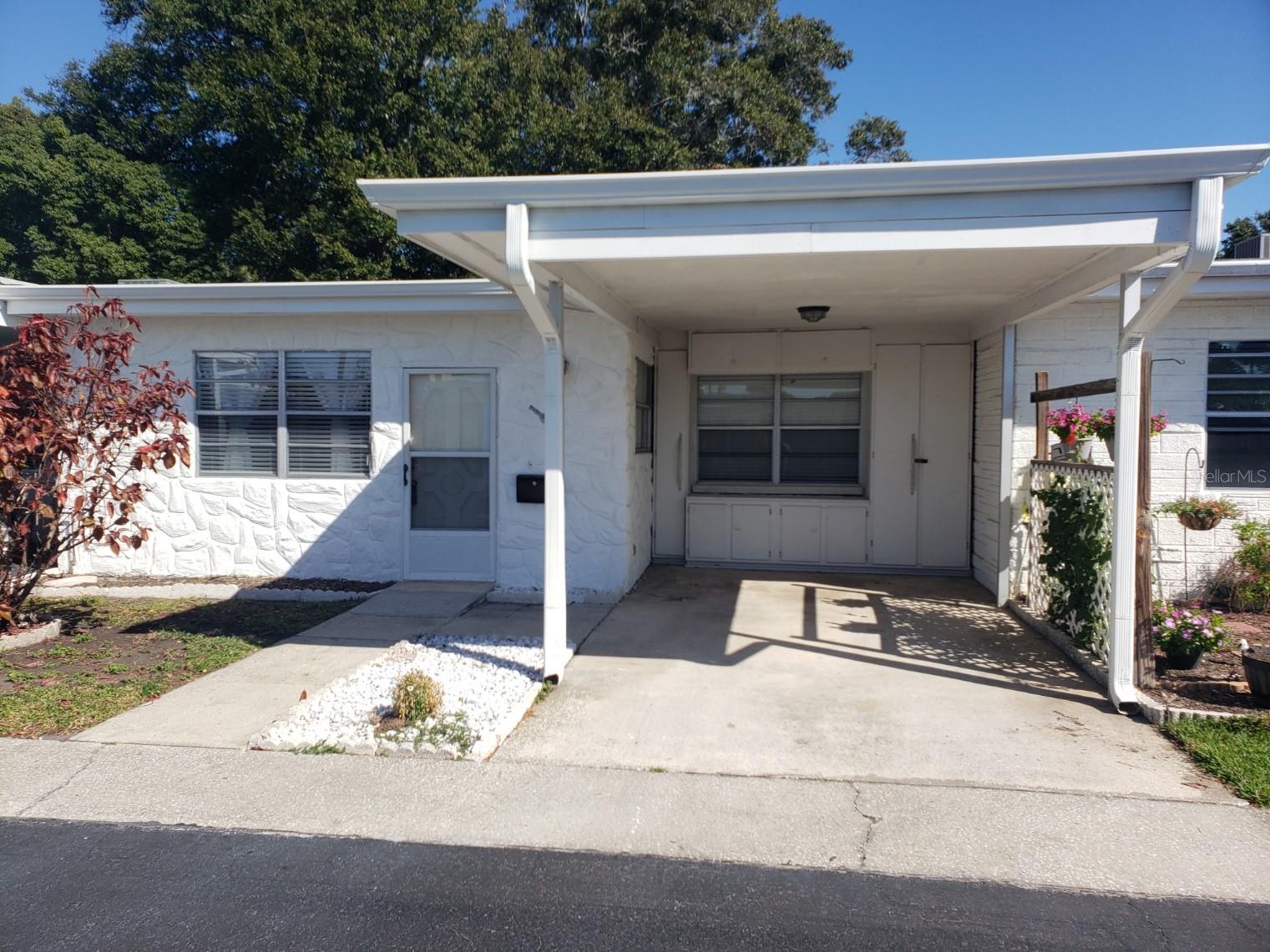 Adorable buttoned-up villa in 55+ Harbor Crest 400 community! Newly updated 2 Bed / 2 Bath unit. Great for primary residence or for an investment property with low HOA fees. Move in ready with the furniture included. Located around the corner to an abundance of shopping, dining, coffee shops, entertainment, and much more. The roof and AC were both replaced in 2019. Updates done in 2022 include new kitchen, newer appliances, water resistant laminate flooring throughout, interior paint, trim work, closet treatments, fixtures, and gutters with new downspouts. It also has indoor laundry with full washer and dryer. The community offers an inground pool, shuffleboard, car wash, and a clubhouse available for entertaining. Fabulous location that is less than 5 minutes to the beach. Enjoy the Sunsets!