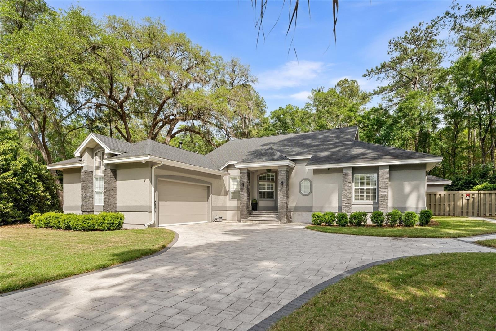 A rare multi-generational estate where luxury living extends well beyond the main house. Set on a private 0.73-acre cul-de-sac lot inside The Preserve at Haile Plantation, this fully renovated estate is designed for families who want everyone close, but living on their own terms.
The main residence spans 3,368 square feet of thoughtfully modern living: high ceilings, 4 bedrooms, 4 full baths, and a floor plan that transitions effortlessly from quiet mornings to full-house entertaining.
Step outside and the property becomes something else entirely. A gas-heated pool and spa anchor a backyard built for real use, with a summer kitchen, fire pit, and genuine room to breathe. The detached 800-square-foot cabana is a destination in its own right: full kitchen with gas range, bamboo flooring, and a hand-crafted cedar sauna built from the finest knot-free clear wood. Guests arrive and don't want to leave.
For extended family, or anyone who values their own entrance, the 750-square-foot in-law suite delivers a private bedroom, full bathroom, and kitchenette. It feels like a home, not an accommodation.
Beyond the gates, Haile Village Center is a short walk away: local restaurants, boutiques, a weekly farmers market, miles of trails, and the fairways of Hawkstone Golf & Country Club. Everything, without giving anything up.
**SELLER WILLING TO REPLACE OR GIVE CREDIT FOR MAIN AREA FLOORING**