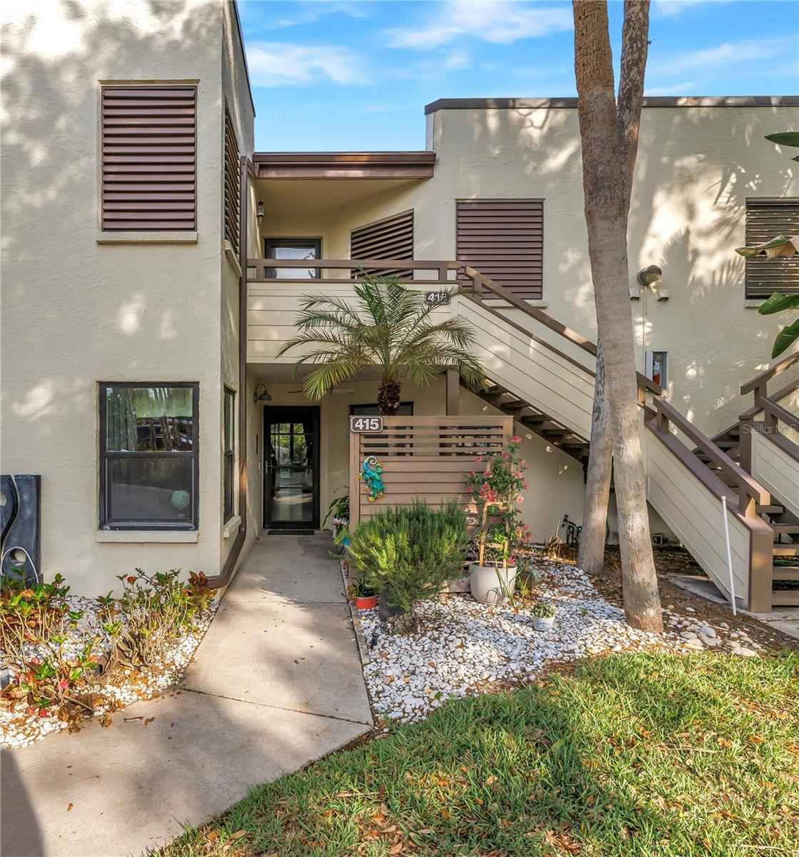 Welcome to popular Spring Lakes a dedicated bird and wildlife sanctuary evidenced as you meander through the lushly landscaped neighborhood.  This ground level home is uniquely different from most other floor plans in that the updated kitchen is large enough for a sizeable dining table in addition to a darling coffee station and full-size washer and dryer.  Updates include deep quartz sink and counter tops, pull out pantry drawers, soft close 42” upper cabinets and drawers and attractive tile backsplash complimented by ambient lighting.  The split plan provides for maximum privacy with bedrooms separated by the living/dining rooms.  No mismatched floors in this continuously tiled on the diagonal floors throughout the entire home, complimented by updated baseboards and crown molding in the living/dining room.  Both baths have been updated with quartz counters on the newer vanities and safety grab bars installed in the showers with the primary bath having plenty of closet space including a walk in.  It is offered fully furnished and, most importantly, all windows have been replaced with expensive storm rated windows and sliding doors maximizing efficiency and noise reduction.  You will enjoy the view and sitting on the private 22X10 beautifully pavered patio overlooking more Florida fauna.  This phase of Spring Lakes is also one of the few if not only, that has been granted permission for pickup trucks and the roofs were replaced in 2025 and is completely paid for. This building is slated to be painted in the next several months with no assessment. The AC and water heater were replaced in 2025 so all of the big-ticket items have been accounted for.  This lovely Florida landscaped neighborhood offers several pools and spas as well as tennis and pickleball courts that many of the residents enjoy daily.  The location is the best of the best being 5 to 20 minutes from everything Manatee County has to offer including our wonderful white sandy beaches, golfing, boating, groceries, retail shopping, medical facilities, houses of worship, live and on screen theaters, museums, tons of sport venues, shop till you drop at UTC Mall and famous St Armands Circle, Downtown Bradenton’s River Walk, and last but not least, Sarasota Bradenton International Airport.  Come make this special home yours before it is gone.