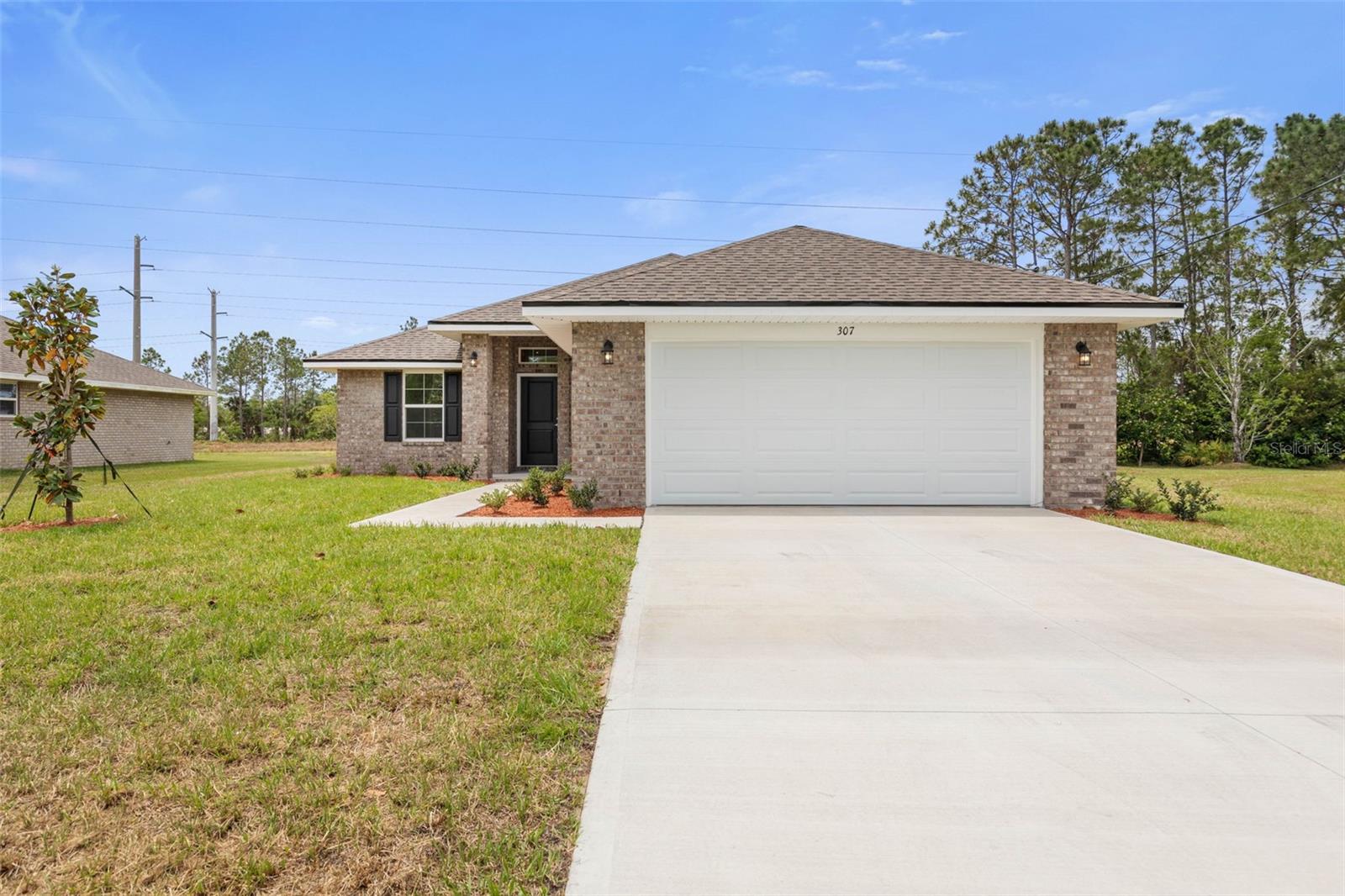 Under contract-accepting backup offers. Under Construction. Only $1,000 deposit required & CLOSING COSTS PAID WHEN USING AN APPROVED LENDER, SAVING BUYERS THOUSANDS OF DOLLARS!! This home is under construction. Welcome to your brand new dream home in beautiful Palm Coast. With NO HOA or CDD, this thoughtfully designed REAL BRICK 1505 floor plan offers the perfect blend of comfort, functionality, and modern style. Boasting 3 spacious bedrooms, 2 full bathrooms, and 1,571 square feet of living space, this home is ideal for anyone looking to enjoy Florida living at its finest. Step inside to discover an inviting layout with a seamless flow between the living, dining, and kitchen areas—perfect for entertaining or everyday living. The modern kitchen features sleek Granite countertops and plenty of cabinet space, opening to the family room that leads out to the backyard and covered lanai. The private owner’s suite offers a peaceful retreat with a walk-in closet and en-suite bath featuring dual vanities and a five foot shower stall with glass door. Two additional bedrooms provide ample space for guests, a home office, or hobbies. Situated in the Seminole Woods "S" Section in Palm Coast, you’ll enjoy no HOA or CDD fees and close proximity to local parks, beaches, shopping, dining, and schools. With quality construction and builder’s warranty, you can buy with confidence. Whether you’re looking for your first home, a forever home, or a vacation escape, the 1505 plan is a must-see! Schedule your showing today and experience Florida living! **Photos are not of actual home and are for illustration purposes only. Finishes/colors may vary from photos**