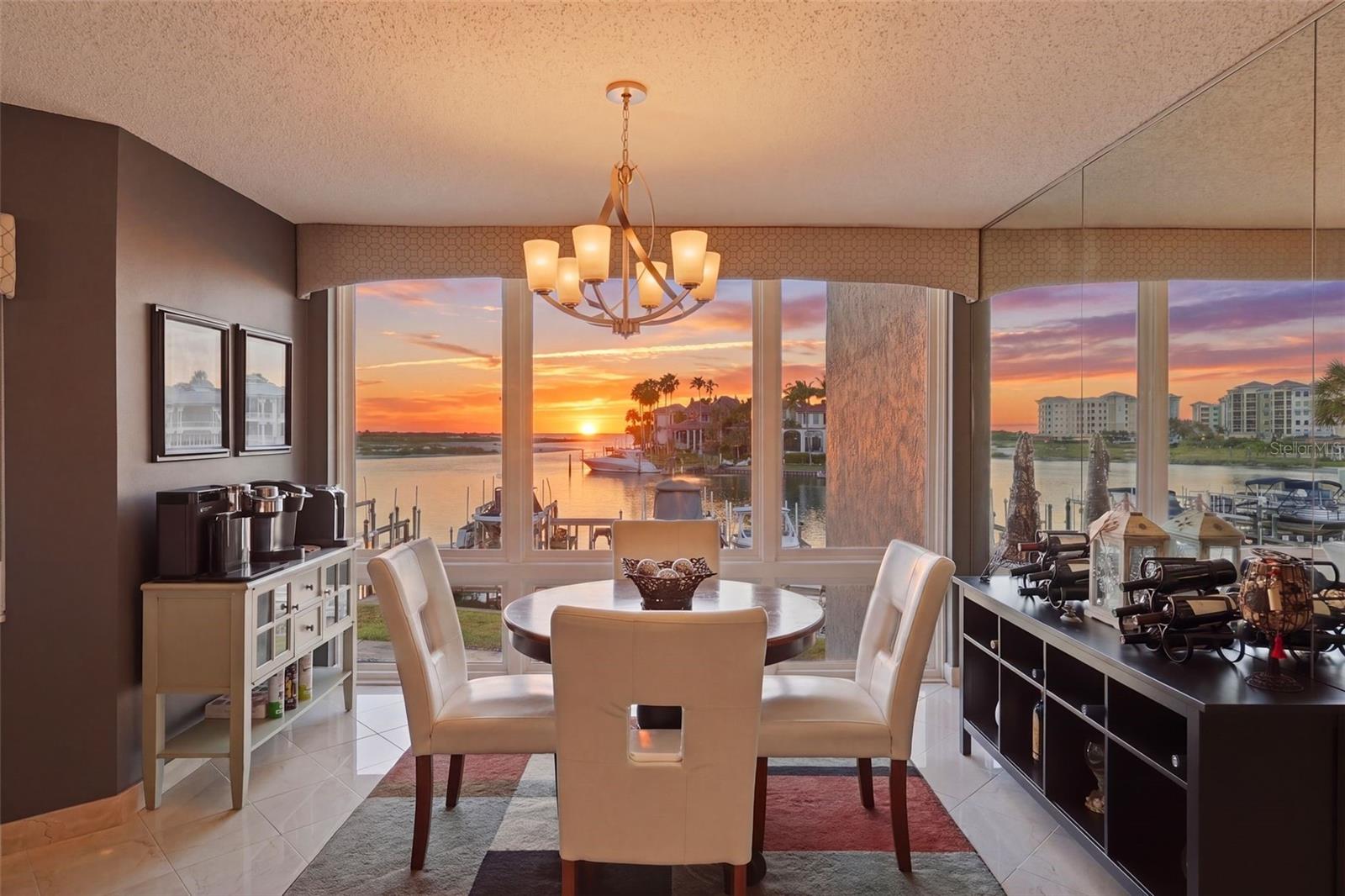 The rarest combination of gorgeous, direct Gulf views and deep, protected boating water is available in this updated, single-level, fully furnished residence at Cove on the Gulf, a boutique complex on Tierra Verde’s Grand Canal. The unit includes a slip with a 10,000 lb lift, and its supreme placement offers immediate access to the Gulf, the Pass-a-Grille Channel, and the Intracoastal. Positioned toward the south end of the building, Unit 204 captures sweeping views across the canal to Shell Key Preserve and the Gulf of Mexico beyond. 

Inside, a contemporary aesthetic and an open great-room floor plan create a light, easy interior that lets the water take center stage. The living area opens to a spacious balcony with glass railings that maximize the view — sunsets, dolphins, and the daily parade of boats become part of your daily routine. A wood-burning fireplace keeps you warm on the few cold winter nights, and hurricane protection is in place throughout. Elevator access and thoughtful interior updates make this your effortless home from day one. Cove on the Gulf is a boutique community of just sixteen residences, with a heated waterfront pool and spa, fishing pier, covered parking, and under-building storage for kayaks and paddleboards.

Tierra Verde is what makes a home like this so rare. The island offers a quiet, residential rhythm: walk to local restaurants, the Tierra Verde Marina, and the Island Grille, bike the trails to Fort De Soto’s 900+ acre park and the world-class beaches of St. Pete Beach. Yet downtown St. Petersburg is close at hand, with its museums, arts scene, waterfront parks, and renowned dining. It’s the rare address that delivers both the laid-back island life and immediate access to one of Florida’s most exciting cultural destinations, with Tampa International Airport an easy drive beyond. Homes like this – with direct Gulf views, deeded slip, single-level, fully furnished, in a sixteen-unit building — don’t surface often.