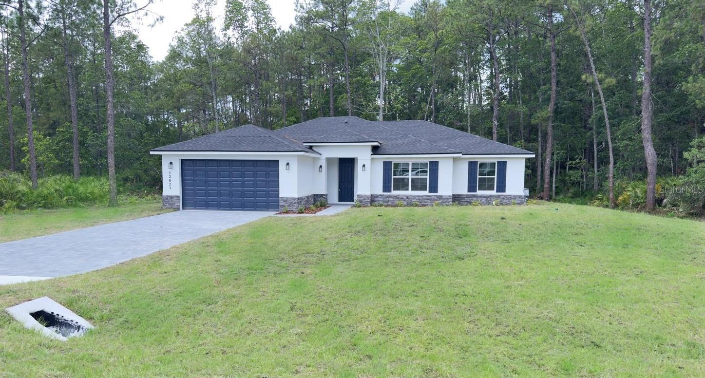BRAND NEW HOUSE ON 1 ACRE LOT - HORSE FRIENDLY - BACKS ONTO 78 ACRES OF STATE LAND - MOVE-IN-READY !!! Beautiful new construction home in the desirable Royal Trails community, set on a spacious 1-acre lot and designed to give the perfect blend of modern comfort and peaceful country living. This RV-friendly community with deeded access to Lake Norris provides space, privacy, and a relaxed rural lifestyle while remaining conveniently located near everyday amenities. This thoughtfully designed residence features 4 bedrooms,
2 bathrooms, and a bright open-concept floor plan ideal for everyday living and entertaining. The kitchen will showcase modern finishes and
quality upgrades, opening seamlessly to the main living area. Waterproof luxury vinyl flooring throughout the main areas adds both style and durability. Royal Trails offers a unique rural lifestyle with convenient amenities, including deeded access to Lake Norris, a community park, playground, pavilion, and approximately 26 miles of roads for walking and biking. Zoning allows up to two horses pr acre, and RV and motorhome parking are permitted. Surrounded by the Ocala National Forest and Seminole State Forest, this property also backs to approximately 78 acres of state-owned land, providing exceptional privacy and a beautiful natural backdrop with no rear neighbors. Yet it remains conveniently located near Eustis, Mount Dora, Deland, and Lake Mary, with easy access to the Wekiva Parkway and SR-429. Beaches, Orlando attractions, and both Orlando and Daytona International Airports are about an hour away. A rare opportunity to own new construction on acreage in Royal Trails. Schedule your showing today.