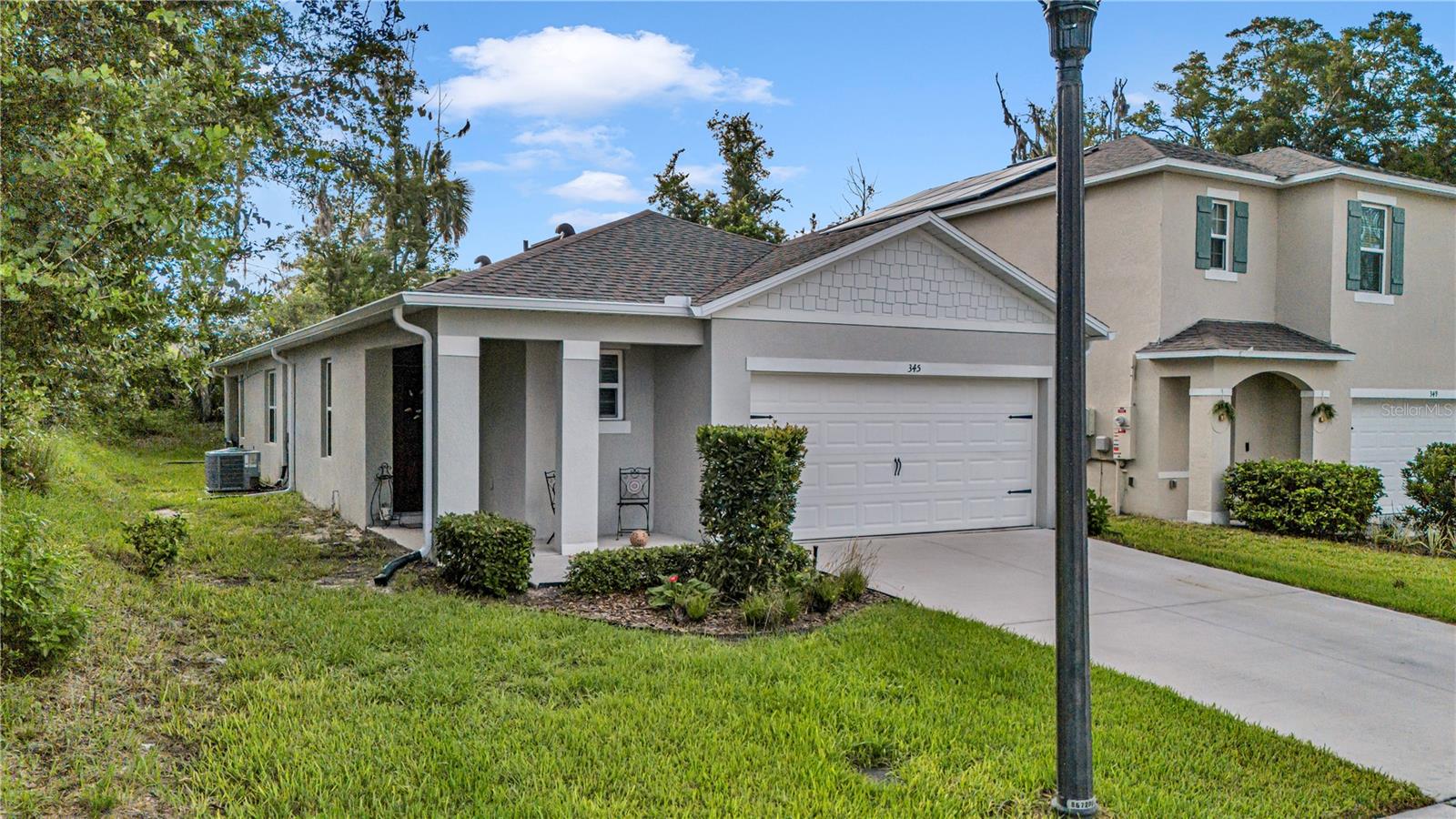 Welcome to this stunning D.R. Horton "Jemison" home, perfectly situated on a corner lot in the highly sought-after Pelham Park subdivision. Built in 2023 and beautifully maintained, this 3-bedroom, 2-bathroom residence offers an exceptional blend of modern comfort, smart technology, and thoughtful design. Step inside to a spacious, light-filled foyer featuring inset lighting that sets an inviting tone for the home's bright, open-concept layout. At the heart of the home is a chef-friendly kitchen boasting sleek stainless-steel appliances and laminate countertops. The private primary suite serves as a relaxing retreat, complete with a generous walk-in closet and an upgraded ensuite bathroom featuring a double vanity and a ceramic-tiled shower. Two additional bedrooms share a bright second bath equipped with a convenient shower-tub combination. Natural light pours into the main living space through sliding glass doors that open to a private, peaceful lanai with a wooded buffer between neighbors, offering the ultimate setting for outdoor relaxation. 

This turnkey home is packed with premium, practical upgrades, including new gutters installed in 2025, a transferable Massey termite bond, a three-zone sprinkler system with automated timers, and seamless carpet and tile flooring throughout. Everyday convenience is built-in with a dedicated utility room that includes the washer and dryer, a two-car garage with an automatic opener, and enhanced safety from six integrated fire and carbon monoxide detectors. Connected to city water and sewer (with estimated monthly costs available upon request). The Community also has perks like a neighborhood playground, gazebos, and walking trails, making it an excellent primary residence or a high-potential rental opportunity. Location is unmatched for commuters, offering an easy drive to Orlando, Daytona Beach, and nearby Stetson University, while sitting approximately one mile from the DeLand SunRail Station. Don't miss your chance to own this move-in-ready gem with strong value in booming DeLand—schedule your private tour today, available by appointment only.