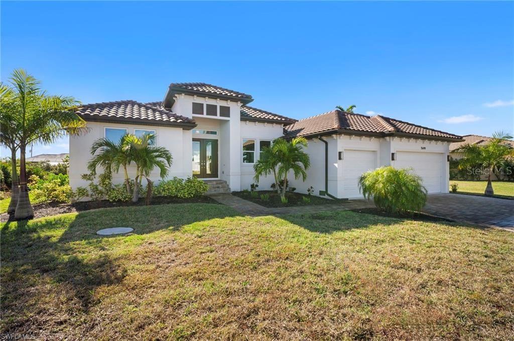 ***Due to medical reasons, sellers are motivated. Significant price drop.*** Bring your sailboat! NO BRIDGES, gulf-access living awaits. This is a NEVER LIVED IN NEW CONSTRUCTION over 2300 sq. ft. home situated on a 0.23-acre waterfront lot. A custom-built POPE constructed home offering the perfect blend of modern design, functionality, and Florida lifestyle. The open concept living space features 3 bedrooms, 3 full bathrooms, a den/office, a formal dining area, and a large utility room. The spacious great room is highlighted by high ceilings, crown moldings, and an impressive disappearing four panel slider which seamlessly provides indoor-outdoor flow, expanding into the heated pool/spa and lanai. It is perfect for entertaining. At the heart of the home, is a striking kitchen offering a large quartz island with matching countertops. The kitchen features a GAS cooktop and pot filler. This home offers quality cabinetry, and a dedicated wine fridge and dry bar. The primary suite serves as a private retreat with peaceful water views, his and hers walk-in closets, and a spa-style bathroom complete with dual sinks, a walk-in shower and soaking tub. Two additional guest bedrooms are thoughtfully positioned to provide comfort and privacy, with the pool-side bedroom ensuite bath opening to the lanai and pool area. When stepping outside onto the screen covered lanai, you will not only be overlooking the heated pool and spa, but a tranquil canal as well. Additional highlights include generator hookup, 3-car garage with golf cart parking (a new golf cart is available), epoxy garage floor, impact-rated windows and doors, plank flooring throughout, lawn irrigation system, outdoor kitchen, no HOA. This waterfront property delivers a quiet location close to parks, beaches, marinas, shopping, and dining. To top it off, this property offers miles of concrete golf cart trails (a new golf cart is available). You will love the access to the best of Southwest Florida living all in a quiet, desirable South Gulf Cove location. Schedule your private showing today and act fast before you miss your chance at this slice of paradise!