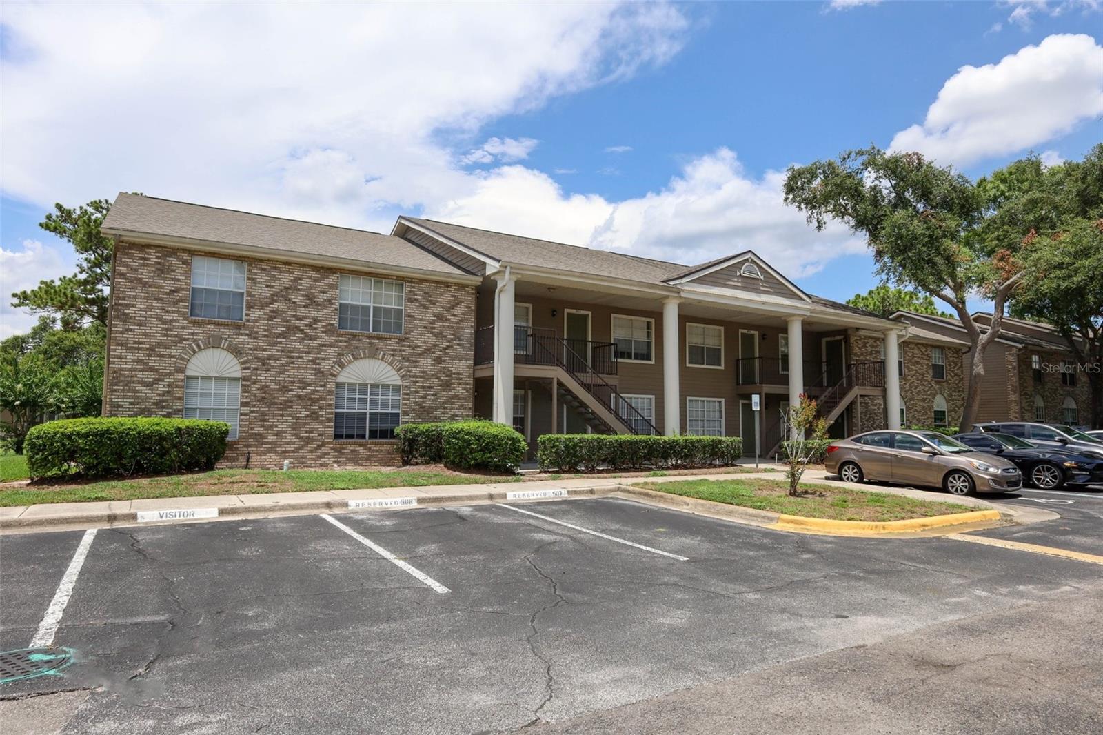 The ultimate in carefree living! This two-bedroom, two-bath condo offers a perfect blend of style, convenience and community amenities. 
This first floor unit boasts a large primary bedroom with a walk-in closet and an ensuite bathroom. The unit has tile flooring throughout for easy maintenance. Enjoy the convenience of a newer stacked washer dryer (2025) and refrigerator (2025), while the A/C (2019) ensures year round comfort. This unit offers amazing open parking along with one assigned parking spot. You'll never fight for a parking spot in this building. Located in a vibrant community with resort style amenities, residents have access to a large swimming pool, exercise room, tennis court, and basketball court. The unbeatable location is just minutes from UCF and within walking distance to grocery shopping and restaurants, making this the perfect home for students, professionals or anyone looking for a well-connected lifestyle. Don't miss out - schedule a showing today!