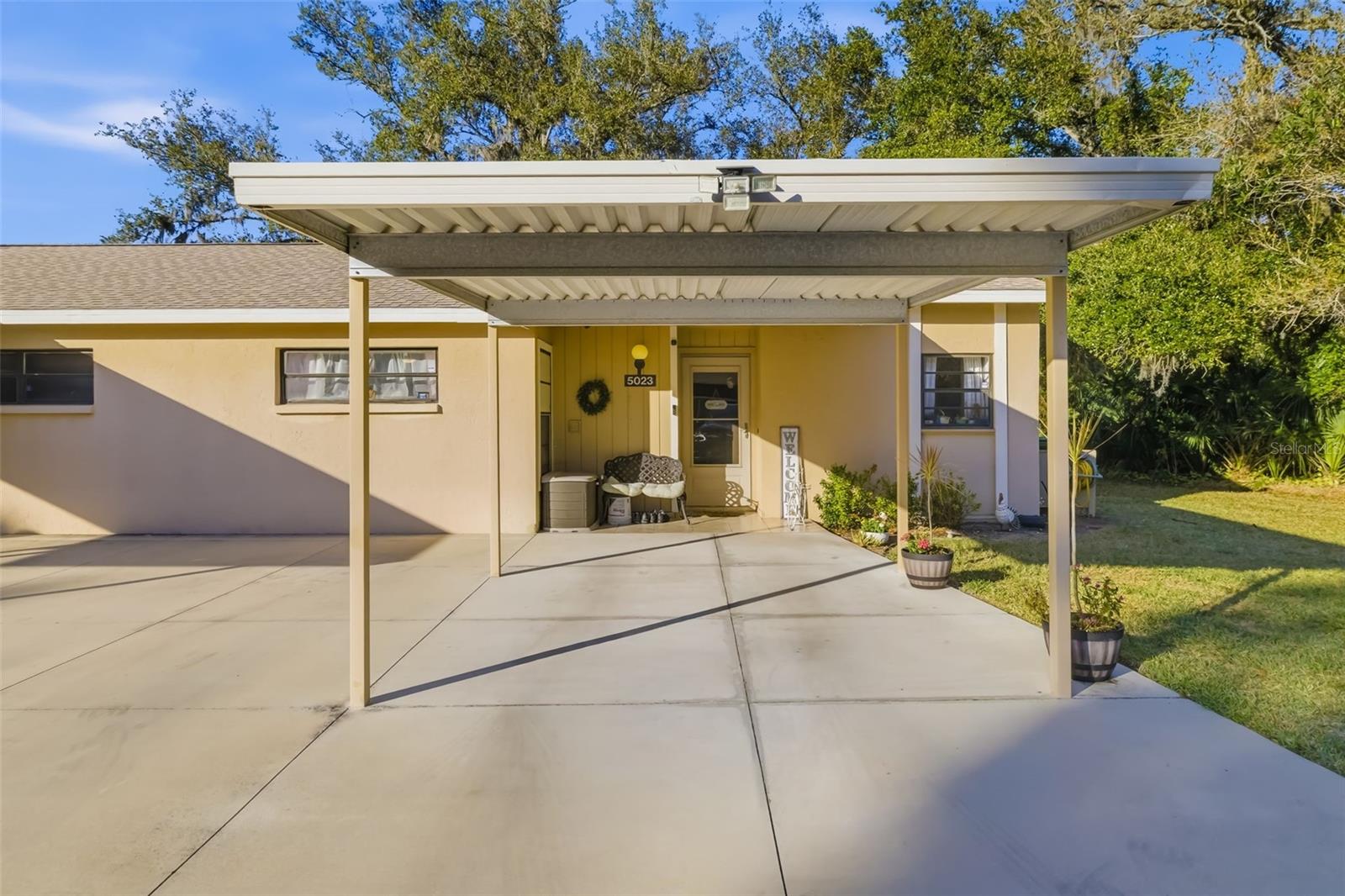 Move-in ready and not impacted by recent storms, according to the owner. In the desirable Village Gardens community, this beautifully updated home is set within a lush, park-like environment with mature tree canopy and exceptional recreational amenities. Residents enjoy access to a heated pool, pickleball and tennis courts, and an active clubhouse. Ideally just north of downtown Sarasota and minutes from the University Parkway corridor, providing convenient access to Sarasota-Bradenton International Airport, UTC Mall, Interstate 75, and renowned cultural destinations including Ringling Museum of Art & Design, Asolo Theatre, Sarasota Ballet, Ringling College of Art & Design and USF. This rare Palm model features a screened-in Florida room, making it one of the larger floor plans in the community. The home was extensively updated in 2023 with new electrical, renovated baths, an updated kitchen, new flooring, baseboards and fresh interior paint, creating a modern and inviting interior. Additional improvements include a paver patio added in 2025, ideal for outdoor relaxation. Inside, the home offers a welcoming foyer entry, a spacious great room with vaulted ceilings and clerestory windows. The kitchen has been renovated with beautiful cabinets, countertops and backsplash. The primary suite includes a walk-in shower, and direct access to the Florida room. The second bedroom has plenty of room and the guest bath includes a tub for soaking. An interior utility room offers additional storage along with a washer and dryer. Additional highlights include roof replaced in 2014 and air conditioner approximately 6–8 years old The HOA covers exterior maintenance and the roof, providing low-maintenance living in one of Sarasota’s charming and convenient communities. A rare opportunity to enjoy easy Florida living in a beautifully maintained neighborhood so move right in!