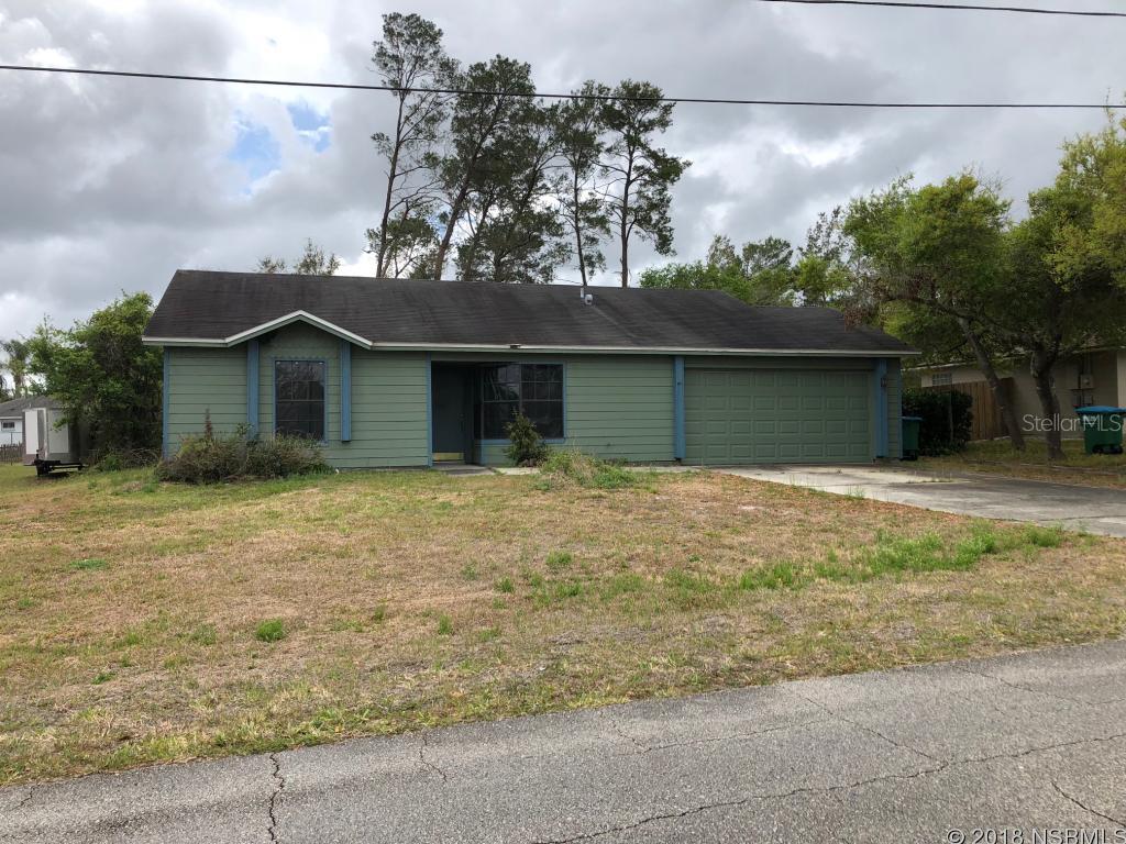Priced to sell at appraised value. 2/2 home with 2 car garage needs a bit of TLC, but has good bones.  Cathedral ceiling in liv. rm. with 2 sky lights. Tall vanities in bathrooms. Nice deep lot with possibilities.  Laminate flooring in kitchen and baths; tile foyer. Will need flooring in bedrooms and liv. rm. and there is no toilet in the guest bathroom. There is a termite certificate. Kitchen sink has a leak. No window treatments. ;Water: City
