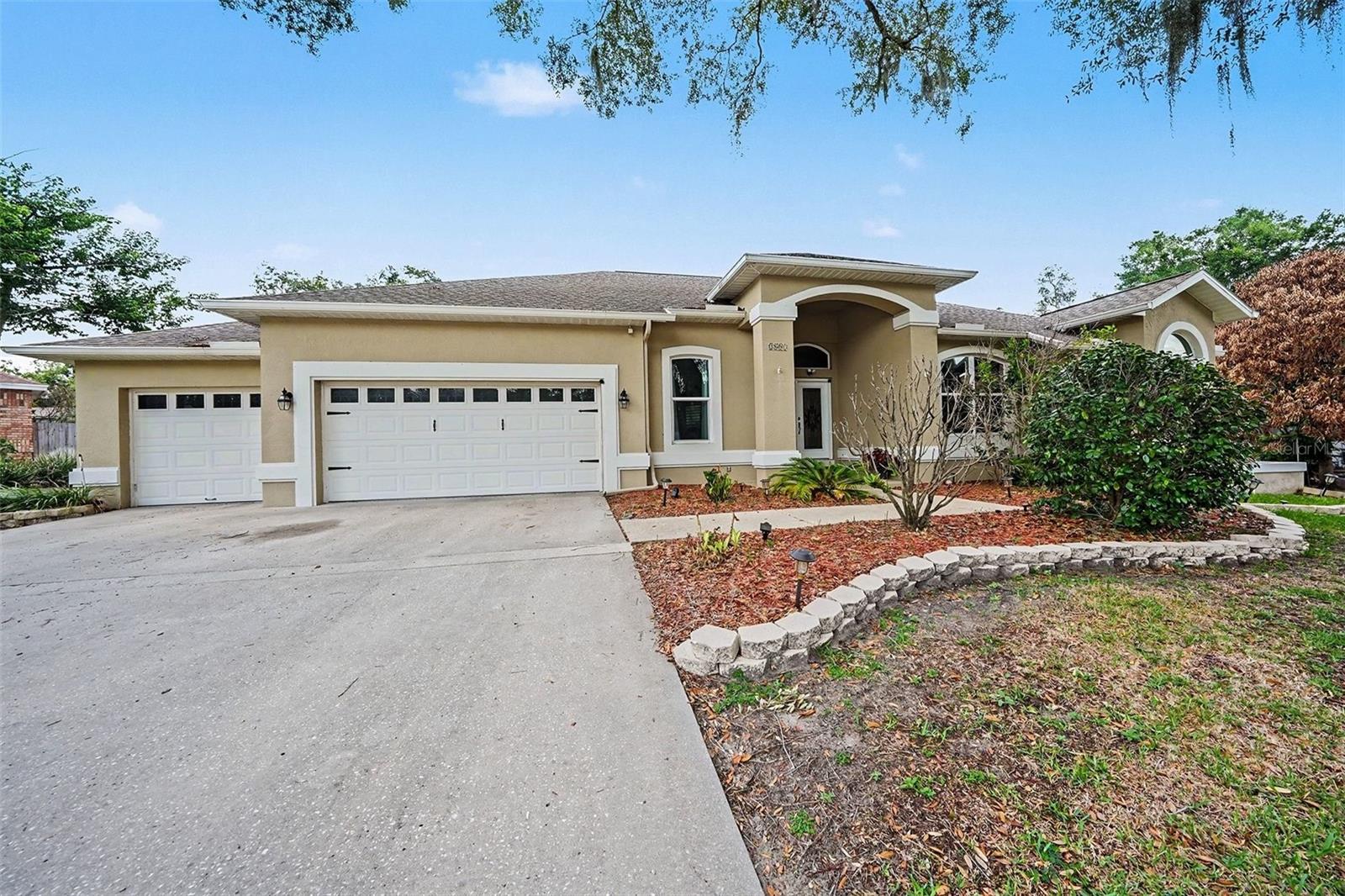 Stunning and rare 4 bedroom (plus office), 3 bathroom pool home with tons of upgrades and luxuries throughout is now available! Located at the end of the cul-de-sac in the quiet Belle Timbre Community on a 1/3 acre fenced lot with storage shed, not only is the house amazing but the location is just as great. Inside is a bright and open floor with built-in features and an inviting dining room & separate living room with pocket sliders out to the spectacular cover rear porch with outdoor kitchen and oversized, caged (recently re-screened), solar heated private pool and spa. Moving forward to the heart of the home is the bright kitchen/dinette and great room space with another set of pocket sliders opening to the pool. Newer kitchen is thoughtfully designed with beautiful shaker cabinets, backsplash, island, cabinet pantry, and plenty of quartz countertops and stainless steel appliances. Natural light abounds throughout this home, cathedral ceiling great room with wood burning fireplace, newer LVP flooring throughout, high impact hurricane rated windows and sliders, tray ceiling in office, lots of extra storage, built-ins and shelving. The private primary bedroom has pocket slider access to the pool, 2 custom closets, en-suite bath complete with updated quartz-topped dual sink vanity, garden tub, and a glass shower. Bedrooms 2, 3, and 4 are on the opposite side of the house. Bedrooms 2 and 3 have a full Jack-and-Jill bathroom and there’s also another full guest bathroom across the hall for convenience. The inside utility room has a handy utility sink, the 3-car garage with overhead built-in storage is accessible from both the kitchen and utility room, there’s also a whole-house water softener included, and the list goes on. This gorgeous, well-maintained home offers a lot of flexibility, with a great open floor plan and a wonderful quiet neighborhood, centrally located near shopping, restaurants, and entertainment. There’s no CDD, no flood insurance required, and a low annual HOA fee so hurry before it’s gone!