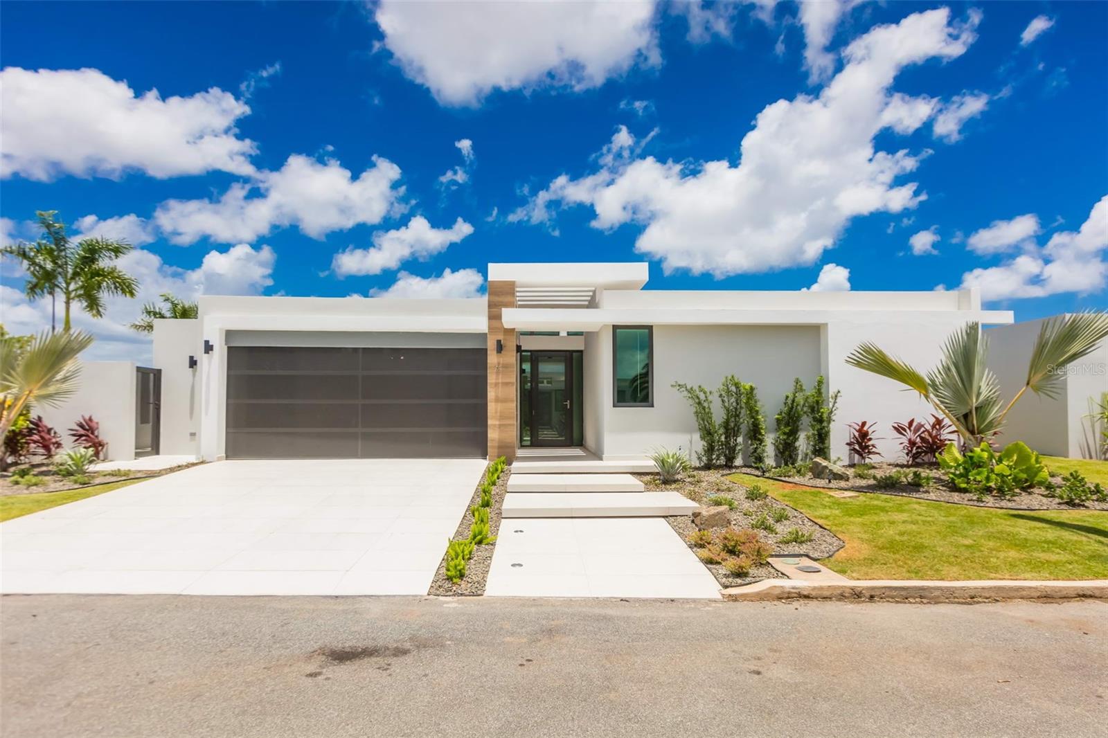 Discover refined living in Residences at Rio with this exceptional single-story corner luxury residence located in one of Bayamon's best new communities. This elegant home offers an interior living space of 2,358 square feet, situated in a 509.8 meters lot. Featuring 3 spacious bedrooms (master with walk-in closet), 3 full bathrooms, 1 powder room, the property is designed for both comfort and functionality. Additional highlights include: garage for two vehicles, an expansive terrace, pool, beautifully landscaped grounds, fully remodeled kitchen, and is offered with A/C unit in all bedrooms and central A/C unit in common areas. Additional essential conveniences include power generator and water cistern to provide peace of mind, making this remarkable residence the perfect blend of luxury, style and practicality. Residences at Rio is a newly well-established residential community conveniently located through Los Filtros Ave. (PR-177), Km. 2.2, right on the border between Guaynabo and Bayamón. Live surrounded by specialty shops, the best gastronomic variety and minutes from the best schools in the metro area.