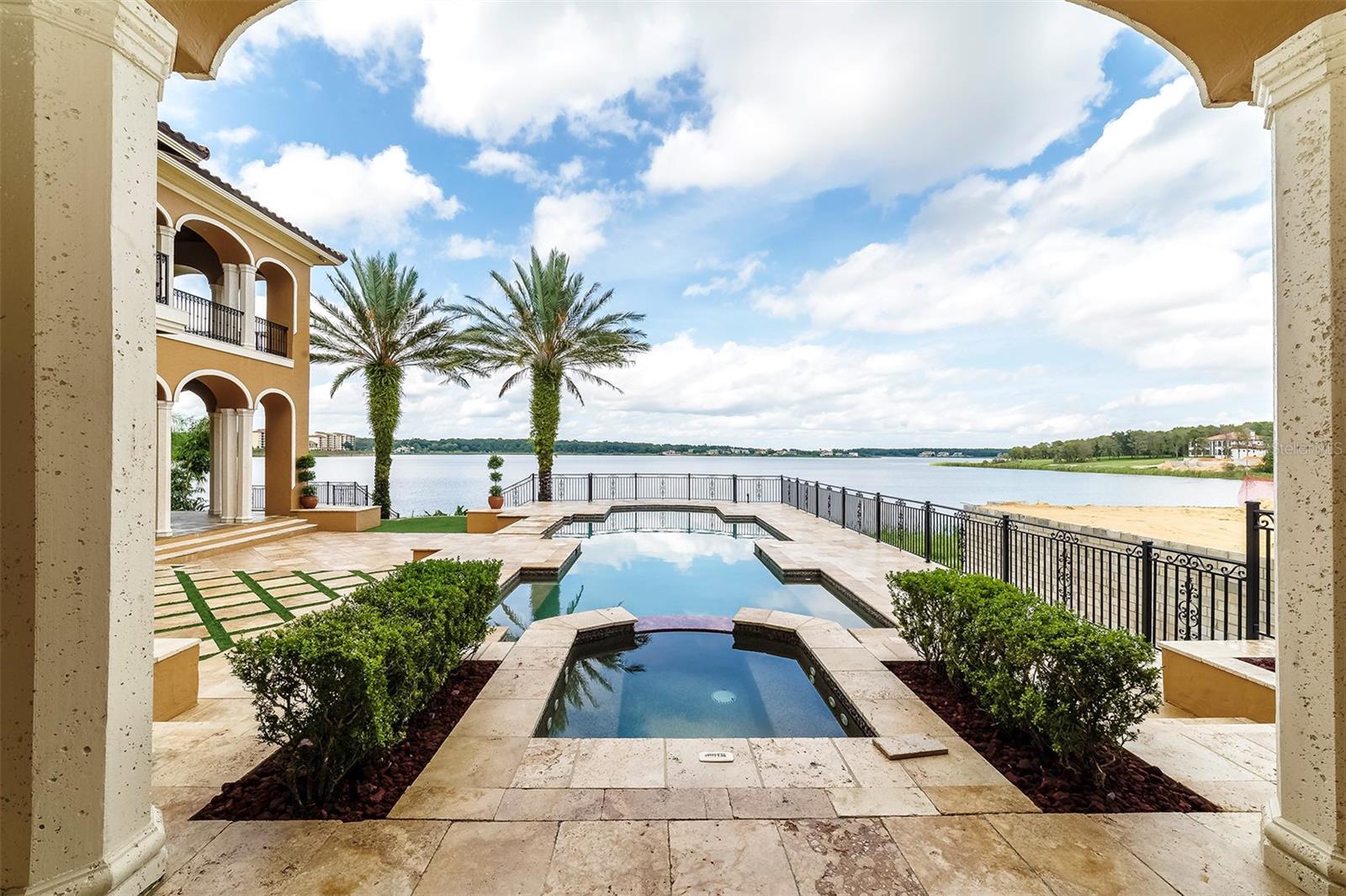 Luxury is on sale. Recently appraised at $4.3 million, the "Montebenichi" is a one-of-a-kind, palatial, waterfront estate in the exclusive Bella Collina Community.  With 6 bedrooms, 9 baths, and waterfront frontage on Lake Siena, this custom-built estate is absolutely breathtaking.  Entering the driveway to this 10,600 square-foot Estate, you will pass through a private gate, then enter a courtyard with 4 garages.  From there, the amenities of this Tuscan beauty are virtually endless: 

*Five different balconies, including two covered patios, overlook an expansive Pebbletecc pool/spa, LED water fountains, and incredible views of Lake Siena

*New Viking appliance package in gourmet, state-of-the-art kitchen, complete with oversized island, 36" fridge, 36" freezer, 60" gas range, granite countertops, built-in microwave, icemaker, under-counter refrigeration unit, and chandelier. New state-of-the-art sound system offers entertainment for every room, with keypads throughout the home. 

*Upstairs gameroom, adjacent to spacious, covered patio overlooking Lake Siena, features a full-service bar with granite countertop, a new dishwasher & new icemaker. Mother-in-law suite above the 4-car garage offers a separate living quarters for guests with its own private entrance in a stand-alone structure, complete with its own bath, new, fully-furnished kitchen, and new washer/dryer 

*Spacious living room with gas fireplace, freshly polished & sealed travertine floors and new chandeliers hung from second-story ceiling with oversized windows overlooking exterior pool, patio & Lake Siena. Showcase wine room, enclosed in stone, holds 600 bottles 

*High-quality finishings throughout, including custom cabinetry, travertine flooring, stone baths, handcrafted artisan entry doors, and hand-painted, faux walls and ceilings. Two laundry facilities in the main part of the estate, one on each level, both with granite countertops & a new washer/dryer. Outdoor kitchen on covered patio includes granite countertops, new grill & new under-counter refrigeration unit

*First-floor master bedroom includes custom, faux walls, hand-painted ceiling, touchscreen controls for new sound system, massive bathroom with custom, stone spa & massive, walk-in closet. Four, second-floor bedrooms all have their own, private bathroom, fresh paint, and walk-in closet. 

*New landscaping. package installed Sept. '23 includes lava rock, numerous trees, shrubs, and sod in entire front yard 

*Numerous new light fixtures, interior and exterior, entire driveway, all patios & travertine flooring all professionally cleaned & sealed, installed Sept. '23

*Custom, faux paint throughout interior and five new A/C units installed Sept. '23. Two new, 75-gallon, gas-powered water heaters installed Sept. '23
*Comprehensive maintenance/upkeep to plumbing, electrical & sprinkler systems, ensuring all are fully operational, Sept. '23

*New heater, pump, filter, and remote control for pool/spa, Sept. '23
 
*Pre-wired for ADT security system, ready to be activated upon move-in. 2006 Parade of Homes Street of Dreams award-winning home.

Bella Collina is a luxury, guard-gate community with over 1,900 acres of rolling hills, a Nick Faldo-designed golf course, tennis courts, gym, resort-style pool, world-class spas, and a breathtaking, 75,000 sq. ft. clubhouse. Many celebrities have called Bella Collina home, including Nick Faldo, Robert Griffin III, and numerous professional athletes.