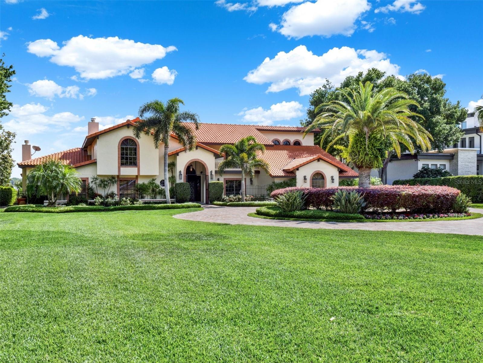 Presenting 9514 Lavill Ct. in the exclusive enclave of Lake Down Village, Windermere—a manifestation of luxury and comfort blended with sophisticated living. This $3,999,000 single-family residence spans across an impressive layout, featuring five bedrooms, three and a half baths, and a host of amenities including a pool with a hot tub, that elevate the essence of upscale living.

The heart of this home, the kitchen, has been meticulously renovated, showcasing the pinnacle of craftsmanship with upgraded Busby Cabinets and state-of-the-art Wolf Appliances. The choice of materials speaks volumes of the home's grandeur, with travertine and wood flooring setting a refined stage for the living areas. The structural integrity is unmatched, with frame bearing walls constructed of 2" x 8" and roof decking comprising 1" x 12" plank, while the second-floor benefits from a double layer of plywood subflooring, ensuring durability and comfort.

The home's design seamlessly integrates luxury with functionality, featuring a dedicated theatre room for cinematic experiences at home, and a Florida room that offers a tranquil retreat with its pool and lake views. The game room, equipped with a bar and a cozy fireplace, presents an intimate space with spectacular views of the surrounding lake, promising countless evenings of relaxation and leisure. 

Beyond its walls, 9514 Lavill Ct. is nestled within Lake Down Village, a prestigious community of only 12 homes. This prime location offers the perfect balance of seclusion and accessibility, with close proximity to the renowned restaurants on Sand Lake, the excitement of theme parks, and the convenience of Orlando International Airport. 

This property is not just a home; it's a sanctuary designed for those who appreciate the Florida Lifestyle and indoor/outdoor living. The property includes a private 2 story dock with parking for your boat and jet skis, inviting endless water activities right from your backyard which is the Butler Chain of Lakes. Schedule your showing today before it's too late.