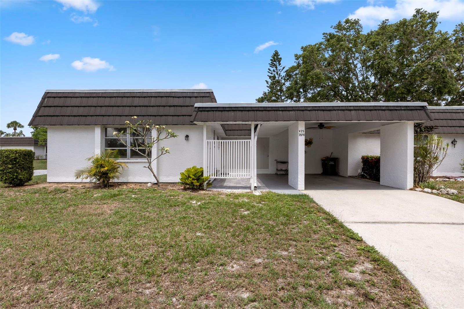 One or more photo(s) has been virtually staged. Back on Market due to previous financing falling through from previous buyer! Make this your home now before it's gone again! Welcome to 3978 Overlook Bend Terrace Unit #25, a delightful updated 2-bedroom, 2-bathroom villa nestled in the heart of Sarasota's sought-after Glen Oaks Ridge Villas—a tranquil 55+ community known for its lush landscaping, well-maintained properties, and vibrant social atmosphere.

This 1,040 sq ft single-story end-unit villa, offers a perfect blend of comfort and convenience. The interior boasts a spacious updated combination dining and living room adorned with ceiling fans and blinds, providing a cozy setting for relaxation and entertainment. The sunlit Florida room invites you to unwind and enjoy the serene surroundings. There are upgrades galore, including new AC unit with all new ductwork and new hot water heater. It also boasts new paver patio, new screened enclosure with solar screening, new ceramic floor tile throughout except master bath. The updated kitchen is equipped with new kitchen cabinets with white subway backsplash and quartz countertops. It also has a new stainless steel refrigerator, stove and dishwasher all catering to all your culinary needs. It also has a newer washer and dryer with added additional storage. This wonderful homes also has new ceiling fans, plantation shutters throughout with a new updated guest bathroom. The master suite features a walk-in closet and an updated vanity, offering a private retreat within your home. 
The community features a heated pool, clubhouse with kitchen, exercise room, game room, shuffleboard and various social activities including a putting green. 
Glen Oaks Ridge Villas provides residents with a great low-maintenance lifestyle, thanks to a homeowners' association that covers the roof and all roof maintenance, pool care, exterior building maintenance, grounds upkeep, insurance, water, sewer, and cable. 

Situated just minutes from downtown Sarasota, the stunning Gulf Coast beaches, shopping centers, restaurants, and parks, this villa offers the perfect balance of peaceful living and urban convenience.

Don't miss the opportunity to make this charming villa your new home in one of Sarasota's most welcoming 55+ communities.