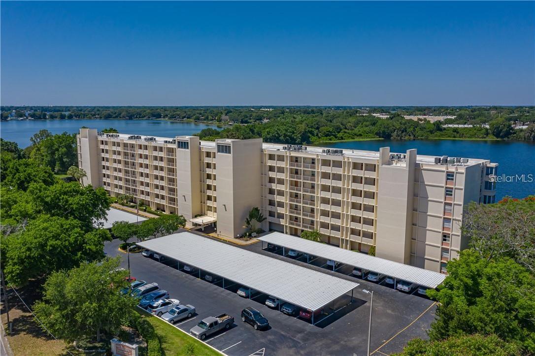 PRICED TO SELL!! **GORGEOUS VIEWS FROM THIS FURNISHED DIRECT LAKEFRONT CONDO** THE 2ND BEDROOM EXTENDS THE LIVING AREA AND CAN BE CLOSED FOR GUEST BEDROOM USE. THIS BEAUTIFUL CONDO IS ON THE SOUTH "CHAIN OF LAKES" IN WINTER HAVEN, FLORIDA (CENTER OF THE STATE LOCATION). THE NICE QUALITY FURNITURE IS INCLUDED. The monthly fee includes cable, internet, water, sewer, trash removal, roof, building insurance, ground maintenance, use of the pool, recreational room, exercise room, and library. The custom design features in this condominium are; raised panel wood cabinets in the kitchen, beautiful granite countertops, custom tile backsplash, stainless steel appliances, and up to date paint selections. Spring Lake Towers Condominium is an (age 55+) NON-SMOKING, NO PETS complex. BOAT SLIPS are currently available for a reasonable yearly fee. This condo complex is immaculate and conveniently located to grocery, shopping, movie theater, medical, places of worship, restaurants, bus line & downtown Winter Haven. Spring Lake Towers holds occasional social events and planned group activities if you wish to participate. This is truly living the Florida lifestyle with a gorgeous lakefront setting. Make this your full-time residence or a winter home. All information is believed to be accurate but not guaranteed. Make your showing appointment today as it is sure to sell quickly. Measurements are approximate.