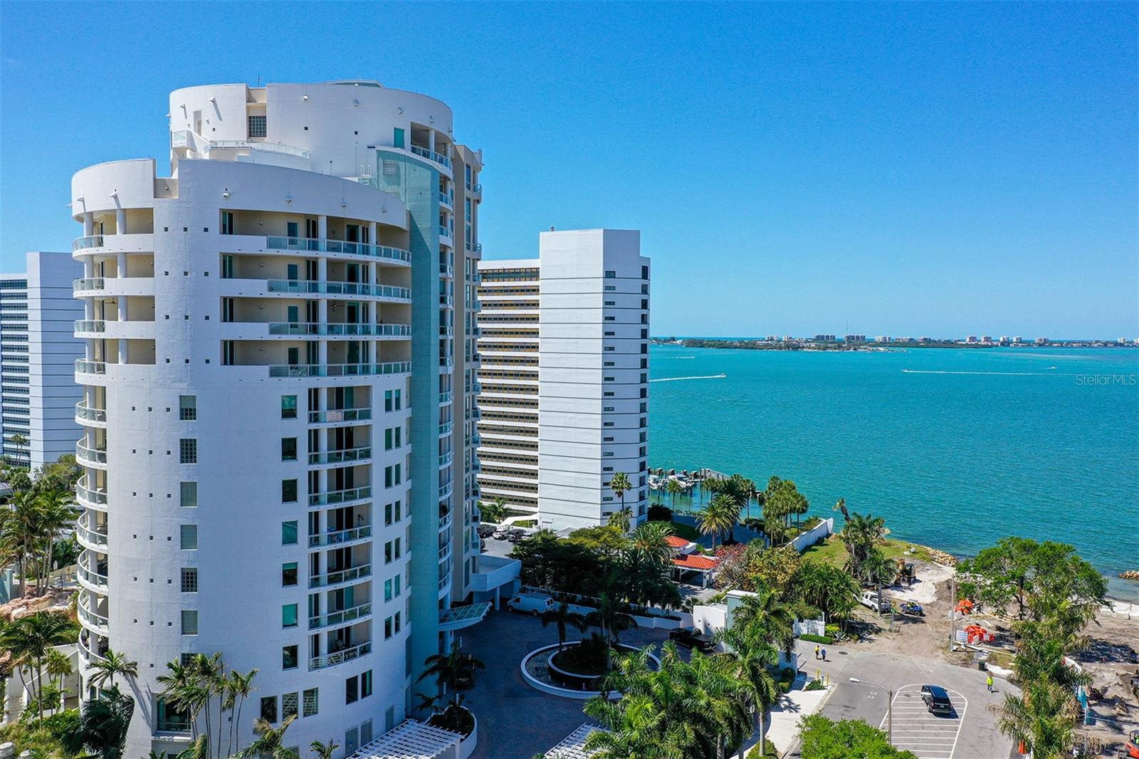Welcome to Beau Ciel #801, an exceptional residence in one of Sarasota’s most iconic bayfront boutique communities—an intimate enclave of just 44 homes, designed for the discerning connoisseur of fine living. Perfectly perched on the quiet 8th floor, this spacious residence showcases unobstructed, panoramic views of Sarasota Bay, where open blue waters meet glowing sunsets and sparkling city lights. Framed by floor-to-ceiling walls of glass, every room is bathed in natural light and oriented to capture the mesmerizing beauty of the bay, and the lush grounds of the nearby The Bay Park and Garden Club. Thoughtfully designed to live like a luxury single-family home, the residence features generous room sizes, elegant built-ins curated by a renowned Sarasota interior designer, and new wood floors that seamlessly connect the living room, dining area, and casual family space—all of which open to a sweeping waterfront terrace ideal for entertaining or quiet reflection. From your private elevator foyer, step into a refined world where every detail exudes beauty and craftsmanship. Each bedroom offers en suite bathrooms and ultra-custom walk-in closets, ensuring comfort and privacy for residents and guests alike.  The 3rd bedroom is currently set up as a den/office with a murphy bed. Just steps away from Van Wezel Performing Arts Hall, and moments from Sarasota’s vibrant arts, dining, and cultural scene, Beau Ciel offers the best of coastal city living—elegance and tranquility with urban convenience. World-class amenities elevate daily life and include a social lounge, private dining and executive boardroom, card and game room, fully equipped fitness center, his and her locker rooms with steam, sauna, and massage therapy rooms and a heated pool and spa with barbecue grills for year-round enjoyment.  Additional features include a climate-controlled storage locker, and secure deeded garage parking, ensuring convenience and peace of mind.  Don’t miss out of this celebration of waterfront luxury, artistry, and timeless design—where every day begins and ends with a view.