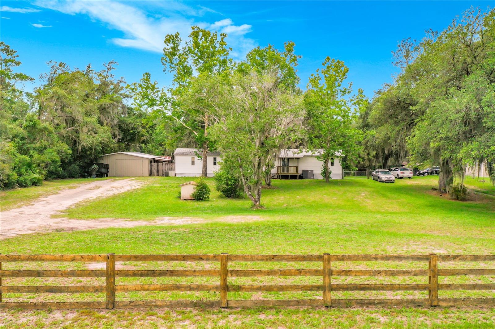 Welcome to Your Country Escape at 31032 Rory Lane! Discover the perfect blend of peaceful acreage and functional living in this spacious 3-bedroom, 3-bathroom Eustis home, completely free from the restrictions of a rigid HOA. This property is a hobbyist’s, mechanic's, or tradesman's dream, featuring a large detached workshop fully upgraded with a brand-new roof and new siding completed in 2025. With three full bathrooms, the interior layout offers incredible flexibility. Outside, the spacious cleared lot gives you plenty of room to park your boat, RV, or trailers, or even start your own homestead. Located just a short drive from downtown Deland and the St. Johns River, you’ll enjoy rural privacy without sacrificing convenience to local shopping, dining, and outdoor recreation. Schedule your private tour today and see all the incredible potential 31032 Rory Lane.