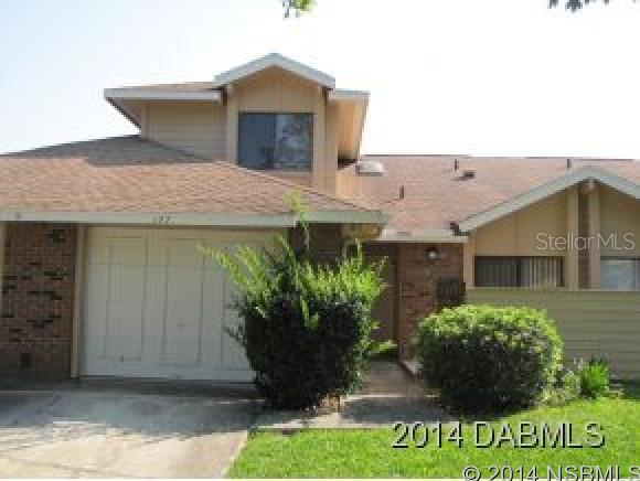 -DONâT MISS THIS ONE!! Daytona Beach 3 bedroom 2.5 bath town home overlooking the golf course in the desirable GATED Pelican Bay community. Open bright floor plan with large updated eat in kitchen, new STAINLESS appliances and a breakfast bar too. Dining room living room combination with Soaring vaulted ceilings, fire place and ceramic title floors. The entertain space also offer a powder room for guest use. Master bedroom down with second and third bedrooms upstairs for added privacy. Nicely sized rooms and closets. Florida room overlooking the golf community is a perfect place to relax, and enjoy the water, and golf course views. Attached garage with newer water heater. The home has been resided and painted, as well a a new A/C system, updated lighting installed in the past year. Towns mini association takes care of exterior paint, pest control, lawn, building insurance and more. $606.00 dollar per year master association takes care of 24hr guarded security and common areas. Enjoy the Florida lifestyle, Near shopping, schools and hospitals, just a few minute drive to the WORLD MOST FAMOUS BEACH.  ** DRIVEWAY FOR THIS HOME AND THE ADJOINING HOME WILL BE COMPLETELY RE-POURED WITHIN THE NEXT TWO WEEKS****** ;Water: City