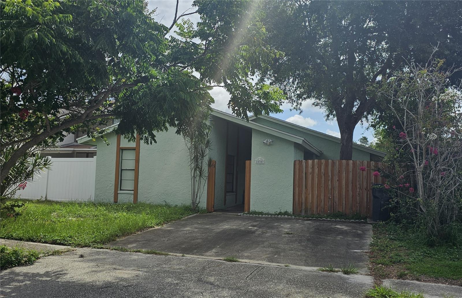 Welcome home to this sweet 3-bedroom, 2-bathroom single-family home nestled in the desirable Carrollwood community of Tampa! This cozy 1,095 sq ft residence features tile, hardwood, and carpet flooring throughout, central air conditioning, and a low-maintenance exterior. Situated on a quiet street with a compact, manageable lot, this home is perfect for first-time buyers or investors. Enjoy all the community  including a pool, playground, park, tennis courts, racquetball, and more — all for a low HOA fee of just $83.00/month. Conveniently located near top-rated Cannella Elementary School and with easy access to shopping, dining, and major roadways. Don't miss this opportunity to own in one of Tampa's established neighborhoods!