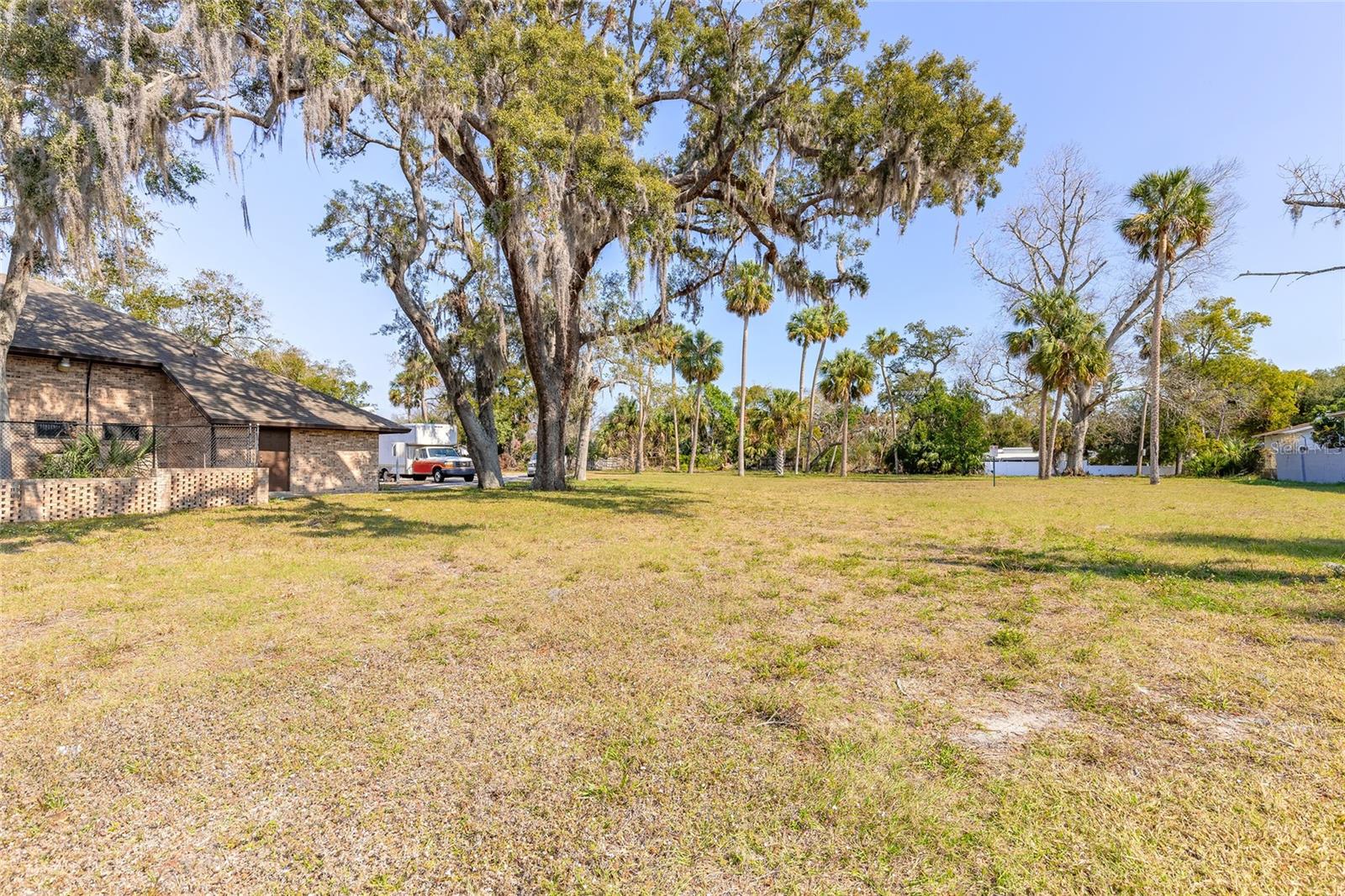 This is a fantastic opportunity to own a prime commercial vacant lot with 100 feet of road frontage in a high-visibility, high-traffic area in the heart of Daytona Beach. This lot is to be offered in conjunction with the neighboring commercial building at 631 N Ridgewood Avenue (list price of $350,000) creating a combined total of nearly one acre of land. Zoned for Business Retail (BR-1), this property offers a range of potential commercial uses, making it an excellent investment. Its central location provides easy access to everything Daytona Beach has to offer, including major highways, shopping centers, and local attractions. Don't miss this chance to secure a valuable piece of commercial real estate in a thriving business district. Outlined drone photos show the commercial building for sale in conjunction to the property.