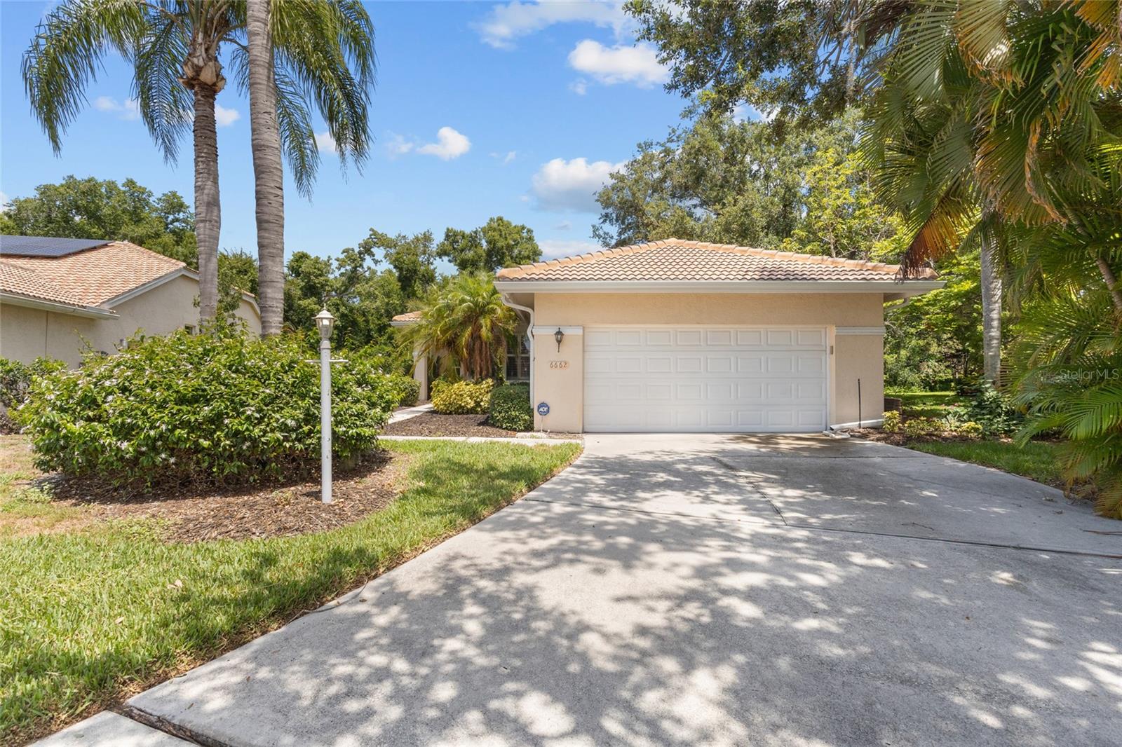 Experience maintenance-free living in the highly desirable River Club golf community with exceptionally low HOA fees, including landscaping services. Situated on a peaceful preserve lot, this beautifully updated home offers privacy, tranquility, and an inviting open-concept layout.

The home features two spacious bedrooms plus a versatile den/office that can easily be converted into a third bedroom. Custom built-ins provide immediate functionality, while the stunning newly remodeled designer kitchen showcases top-of-the-line stainless steel appliances, a large granite chef’s island, and abundant cabinet space.

Additional upgrades include plantation shutters, brand-new flooring throughout the main living areas and kitchen, and an oversized screened lanai designed for relaxing evenings outdoors. The lanai also includes an electric retractable awning for added comfort on warm summer days and offers ample room for a spa with convenient slider access.

Optional memberships are available at River Club, with flexible options for both full-time and seasonal residents. Community amenities include golf, swimming, dining, and a variety of lifestyle offerings. Conveniently located just a short drive from downtown Sarasota, Gulf Coast beaches, shopping, and fine dining, this home combines comfort, style, and an exceptional location.