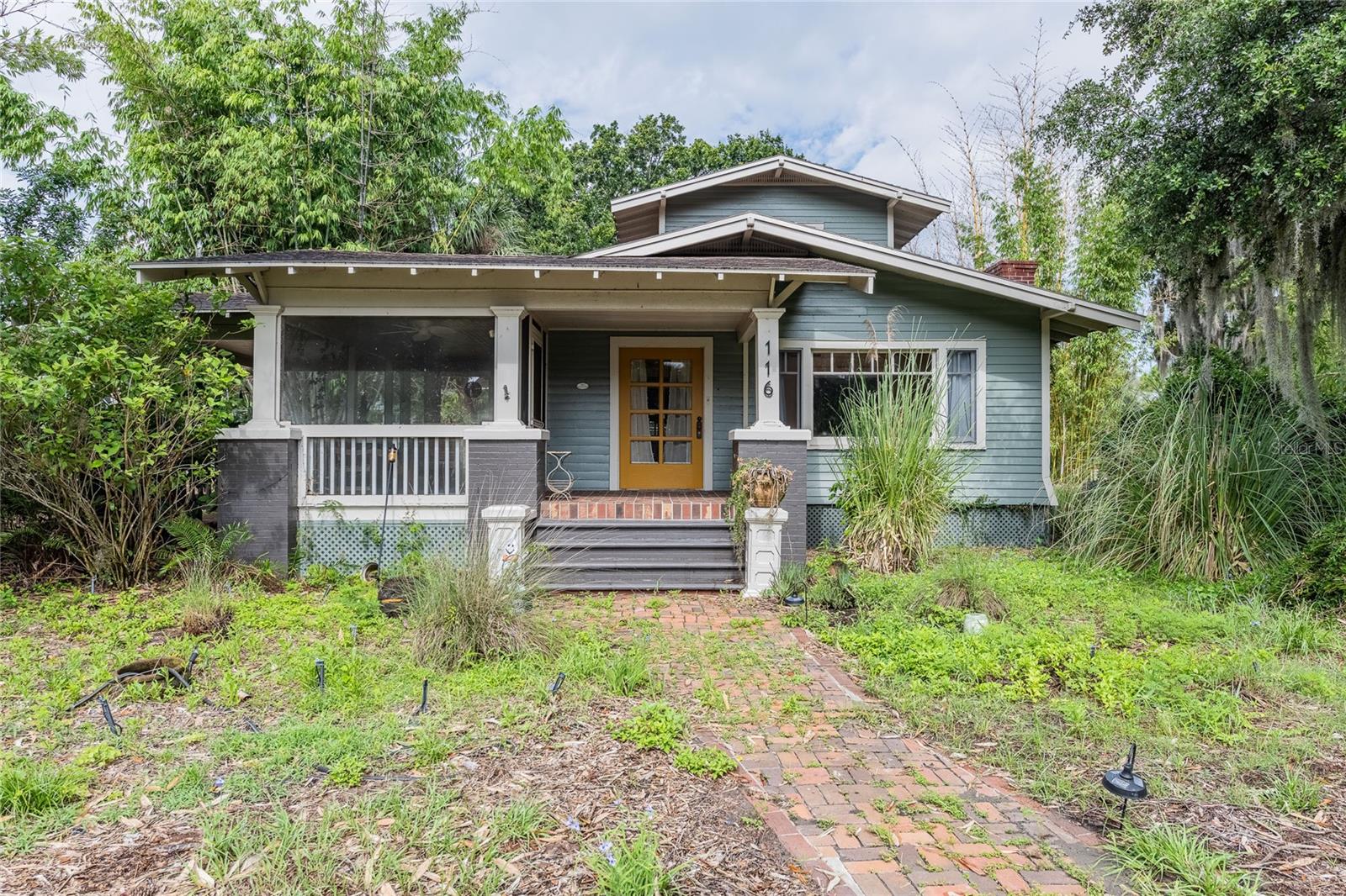 Step into timeless charm and character with this beautiful historic home in Lake Wales offering picturesque views of Lake Wailes. Nestled on approximately half an acre, this 3 bedroom, 2 bathroom home features over 1,900 square feet of heated living space along with a detached 2-car garage and all the warmth and charm you would expect from a historic property.  Inside, the home welcomes you with rich character and inviting living spaces including a cozy living room centered around an amazing wood-burning fireplace, a dedicated study with built-in shelving, and a formal dining room complete with a dry bar area perfect for entertaining. The adorable kitchen offers a gas stove, breakfast area, and plenty of charm throughout. The spacious primary bedroom is conveniently located downstairs, while two additional bedrooms are tucked away upstairs for added privacy.  Enjoy peaceful mornings or relaxing evenings from the wonderful screened-in porch overlooking the beautifully sized yard and scenic lake views. Major updates include an HVAC system that is only 1 year old, offering added peace of mind.  Outdoor enthusiasts will love being just a short walk from Lake Wailes where boating, jet skiing, and fishing can be enjoyed from the nearby fishing pier. Also only minutes away on foot is Lake Wailes Park featuring picnic areas, sports fields, a playground, boat ramp, dog-friendly areas, and a scenic 2.5-mile paved trail surrounding the lake. Conveniently located near shopping, restaurants, medical facilities, and entertainment, this one-of-a-kind property blends historic charm with everyday convenience