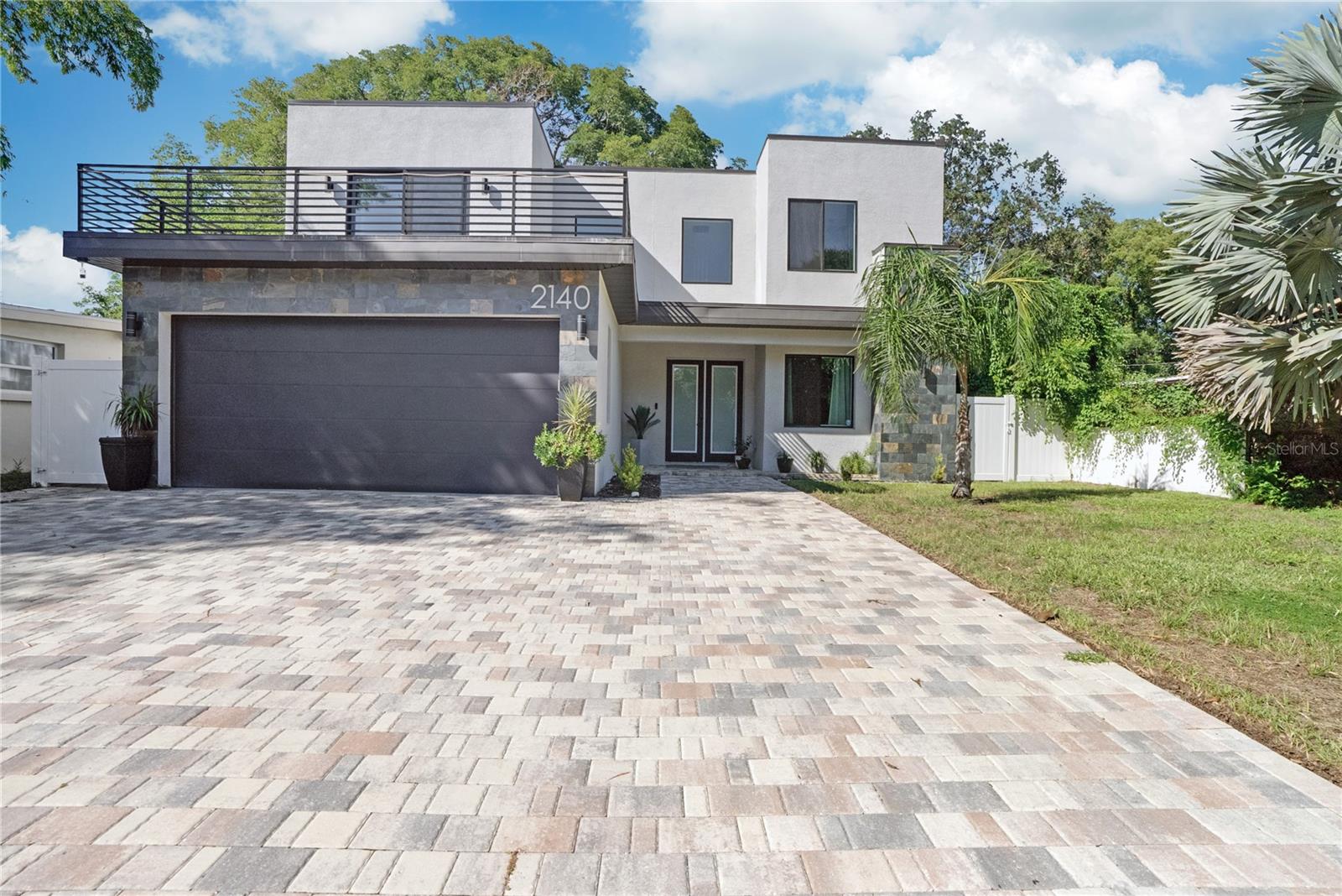 Modern Luxury in the Heart of Clearwater — Experience elevated living just minutes from the beach in this stunning, tech-enhanced contemporary home.

Welcome to 2140 Catalina Dr, a striking 2-story residence where smart technology and sophisticated design come together effortlessly.

This newly built 4-bedroom, 2.5-bathroom home delivers luxury and functionality in a well-established, centrally located Clearwater neighborhood, offering convenient access to indoor and outdoor recreation as well as major commercial corridors with an abundance of dining and shopping options. Inside, you’ll find a bright open-concept floor plan with soaring ceilings, abundant natural light, and upscale designer finishes throughout. The chef-inspired kitchen is equipped with premium stainless steel appliances, custom cabinetry, and a large island ideal for gatherings and entertaining.

Smart home features enhance every space, including voice-controlled lighting, climate systems, a fully integrated security setup, and surround sound. The home also features two private balconies, offering elevated outdoor spaces perfect for relaxing and enjoying Florida’s lifestyle. Upstairs, the expansive primary suite serves as a private retreat with a spa-like en-suite bathroom, oversized shower, and a spacious walk-in closet. The residence is further enhanced by two additional beautifully appointed bedrooms, offering refined comfort and flexibility.

The main-level bedroom offers a sophisticated, multi-functional space ideal for a private office or elegant guest retreat, complete with a custom built-in full-size Murphy bed for seamless style and versatility.

The outdoor area provides ample shaded space to enjoy Florida’s sunny days, along with room to create your dream pool. With NO HOA or CDD fees, this property combines flexibility with outstanding value.

Experience this exceptional Clearwater home—schedule your private showing today.