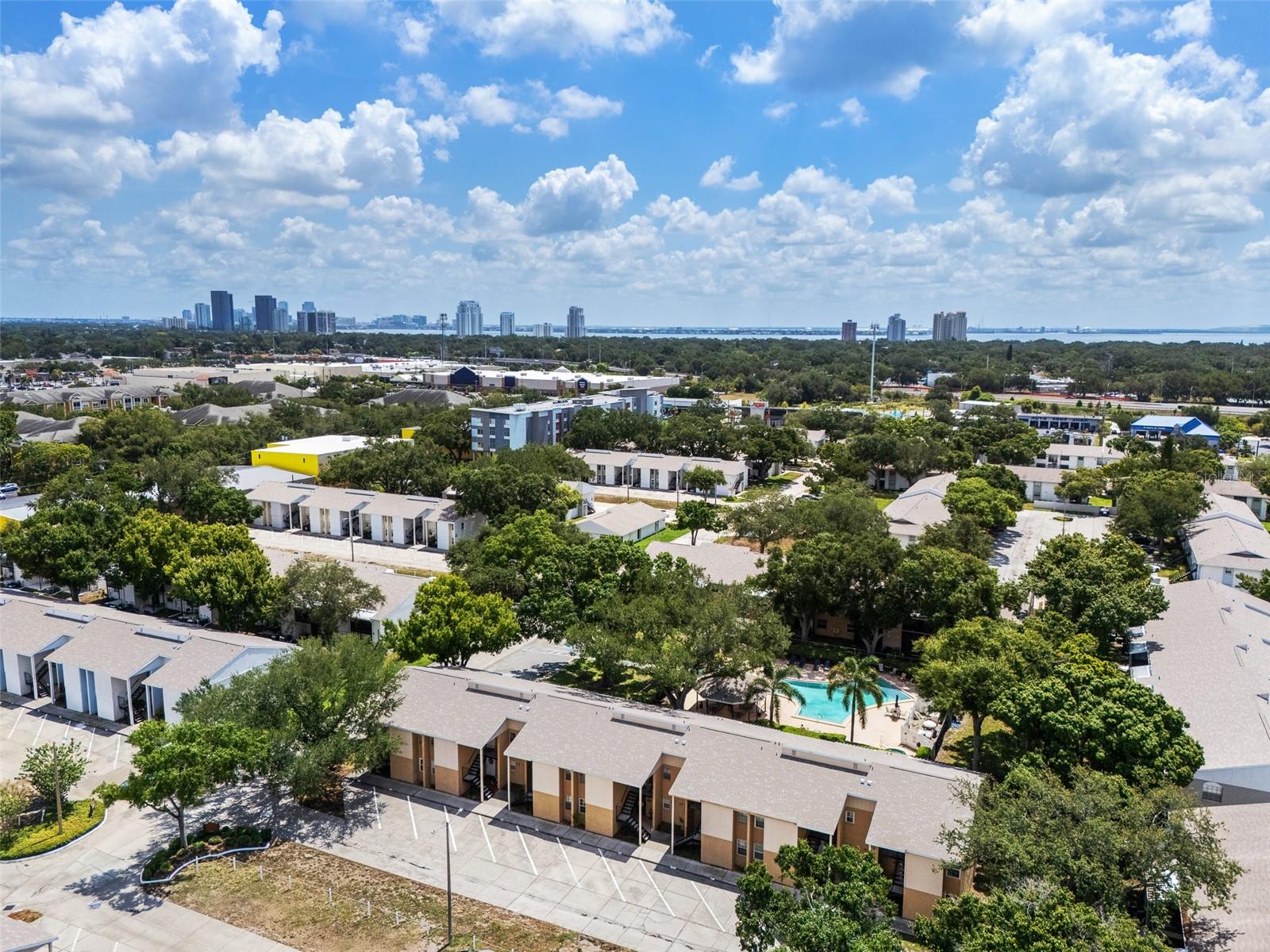 Virtually Staged. Discover the perfect blend of style and convenience in this beautifully remodeled 2-bedroom, 2-bathroom corner unit condo, ideally situated in the heart of South Tampa. Every detail has been thoughtfully considered, from the fully renovated kitchen boasting quartz countertops, an oversized sink, a spacious pantry, and brand-new stainless-steel appliances, to the sophisticated wood-look tile flooring that extends throughout the entire condo. The open-concept living and dining area creates a natural flow, ideal for both entertaining and everyday living. Sliding glass doors lead to a private, screened-in balcony, offering a serene setting for morning coffee or evening relaxation. Retreat to the primary suite, featuring a generous walk-in closet with custom built-ins, and a beautifully updated en-suite bathroom with dual vanities and a tiled shower. This home also delivers lasting peace of mind, with major system upgrades already complete to include a 2022 Trane HVAC system, 2021 water heater, and 2021 PGT hurricane-rated windows. Residents enjoy access to a community pool and spa, with cable included in the monthly condo fees for added value and convenience. Perfectly positioned for the South Tampa lifestyle, this residence offers effortless access to the Selmon Expressway, St. Petersburg, and Tampa International Airport, while remaining just minutes from the iconic Bayshore Boulevard and the energy of Downtown Tampa. A rare opportunity to enjoy elevated, low-maintenance living in South Tampa.
