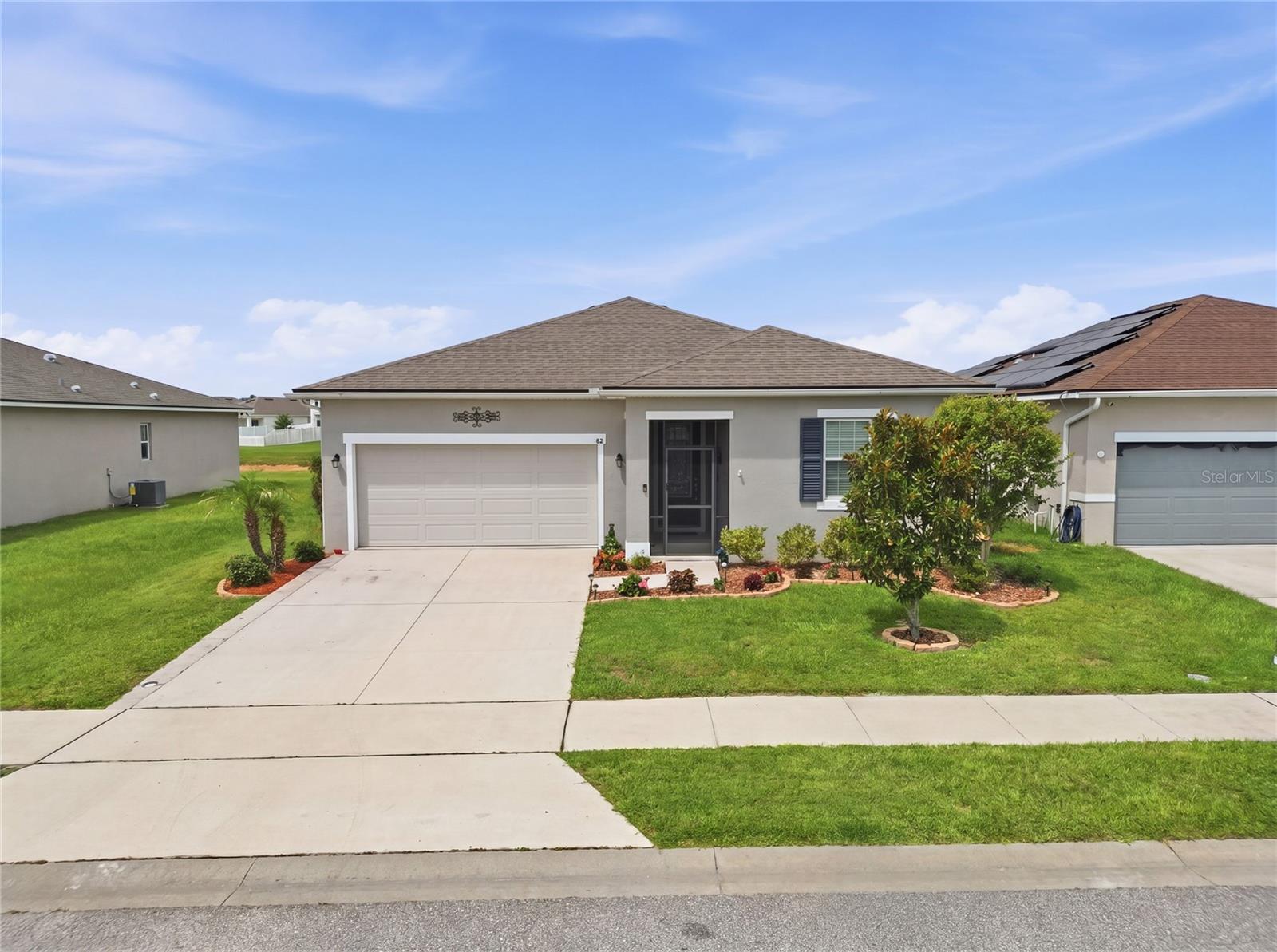 Welcome to this beautifully upgraded 3-bedroom, 2-bath home in the desirable Auburndale area offering comfort, style, and convenience all in one! From the moment you arrive, you’ll notice the attention to detail with the freshly painted exterior, upgraded leaded glass front door, and screened front entry enclosure that creates a warm and inviting first impression.

Inside, the home features an open and functional layout loaded with upgrades throughout. The kitchen is a true standout with granite counter-tops, stainless steel appliances, double oven, soft-close cabinetry, added dining area cabinets for extra storage, and a vented exhaust fan that vents to the exterior.  A feature buyers will appreciate.  The added cabinetry in the dinning area provides both style and functionality, making entertaining and everyday living a breeze!

The spacious primary suite offers stylish barn doors leading into the bathroom, while an additional barn door adds character to the laundry room. Step outside and enjoy Florida living year-round in the over-sized 12x24 screened rear lanai complete with a relaxing hot tub — perfect for entertaining or unwinding after a long day.

Additional highlights include extra garage door access, upgraded finishes throughout, and a location that is hard to beat. Conveniently located near shopping plazas, major highways for easy commuting, and approximately 30 minutes from Disney attractions, this home offers both tranquility and accessibility.

For added piece of mind, the seller is offering a one-year home warranty to the new owner!

This move-in ready gem combines modern upgrades, thoughtful design, and an excellent location, making it the perfect place to call home!  SCHEDULE YOUR SHOWING TODAY!!