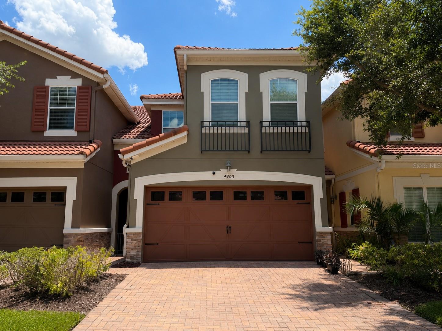 Virtually Staged. Welcome to this beautifully maintained townhome in the highly desirable Tuscany Place community, offering an unbeatable location just minutes from The Mall at Millenia, Costco, Universal Studios, Restaurant Row, I-4, Florida's Turnpike, Downtown Orlando, and Orlando International Airport.

This spacious residence features an open-concept floor plan designed for comfortable everyday living and effortless entertaining. The first floor offers generous living and dining spaces that flow seamlessly into the kitchen, creating a bright and inviting atmosphere. Upstairs, you'll find well-appointed bedrooms, including a spacious primary suite with an en-suite bathroom and ample closet space.

Enjoy your own private fenced patio, perfect for relaxing, grilling, or creating your own outdoor retreat. Additional highlights include an upstairs laundry room, abundant storage, and a low-maintenance lifestyle.

Residents of Tuscany Place enjoy a gated community with amenities including a resort-style swimming pool, clubhouse, and beautifully maintained grounds.

Whether you're looking for a primary residence or an investment opportunity, this home combines comfort, convenience, and an exceptional Central Florida location close to shopping, dining, entertainment, and major highways.

A fantastic opportunity to own in one of Orlando's most convenient locations. Schedule your private showing today!