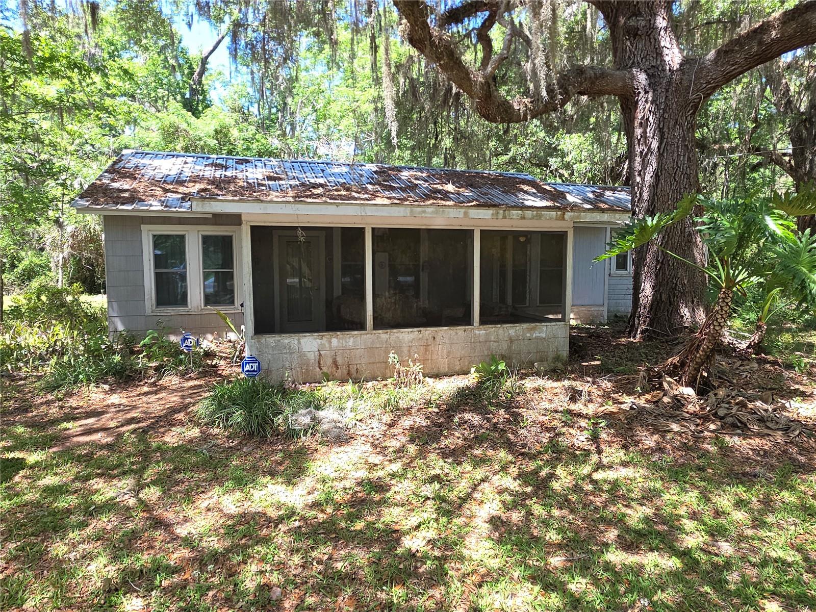 Brooksville 2 Bedroom Home On 29.80 Acres Of land- Enter The Home From The Front Screened Porch To The Great Room- Eat In Kitchen And Dining Area- Dual Sinks And A Pantry- Both Bedrooms Have Separate Bathrooms- There Is A Detached Shed For Storage- Open Floor Plan- Call Today For A Showing.