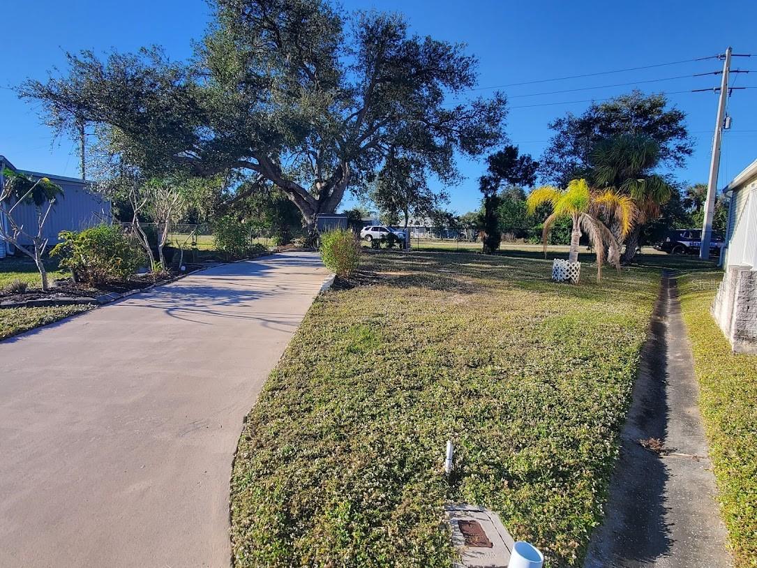 LAND OWNED, DEEDED, 55+ GATED COMMUNITY. Thats right Fee Simple you own the land. ($1556.16 yr
maintenance fee is already included in the property taxes) located in a low traffic cul de sac with a large
Heritage Oak for shade. driveway, FPL meter and Utility meter on site. The park is close proximity to stores, banks, restaurants and the Atlanta Braves
Training Facility, also 2 heated pools, shuffleboard, ping pong, a library, fitness center, pickle ball, bocce ball
and a full calendar of cultural events, plus more! SEE ATTACHED POSSIBLE FLOOR PLANS AND LOT OPTIONS.

PER OWNER THE DRIVEWAY DOES NOT NEED TO BE REMOVED, NPUTILITIES ARE ON YOU WILL HAVE TO PAY $57. MONTH TO KEEP THE WATER/SEWER FROM BEING DISCONNECTED AND PAYING RE-CONNECTION FEE'S