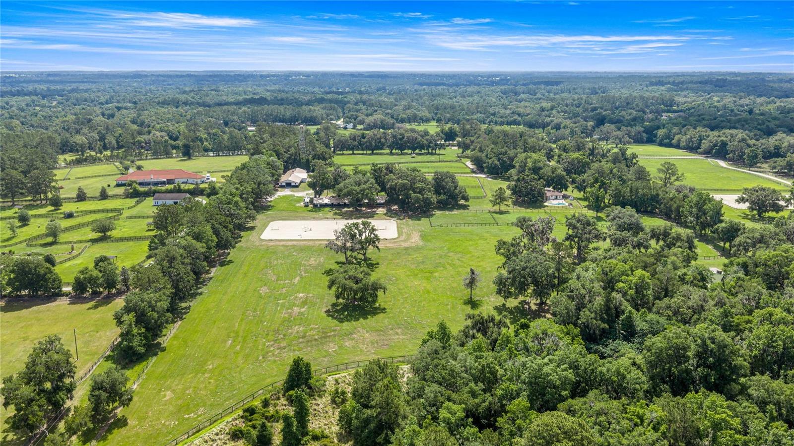 Welcome to an exceptional equestrian estate in the heart of horse country at Ocala — perfectly positioned less than 10 miles from World Equestrian Center and 3.6 miles to HITS Ocala. Situated directly off of US HWY 27 and on nearly 24 picturesque acres, this turnkey horse property blends high-end functionality with the relaxed charm of Florida farm living.

Designed with serious equestrians in mind, the property features a beautifully maintained 20-stall barn with proven seasonal income potential, premium all-weather footing, and thoughtfully laid-out facilities ideal for training, boarding, or competition operations. The grounds provide ample space for paddocks, turnout, riding, and expansion opportunities while maintaining privacy and a peaceful atmosphere.

The approximately 2,500-square-foot main residence has been tastefully updated and provides comfortable, modern living with views of the farm and surrounding countryside. Whether you’re hosting clients, relaxing after a horse show, or enjoying quiet evenings under the oaks, the home delivers the perfect blend of comfort and practicality.