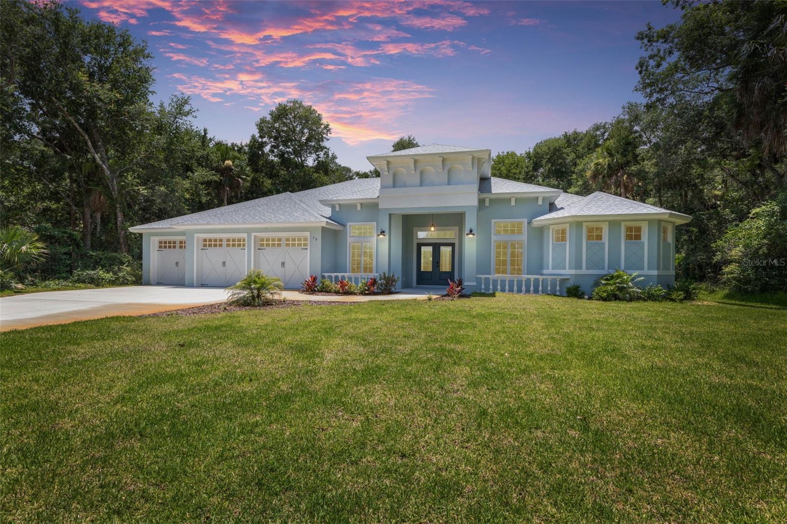 Welcome to this exceptional country estate located in the prestigious gated community of Flagler Polo Club, where luxury, privacy, and natural beauty come together on just over an acre. Backing directly to Bulow Creek, this unique property offers the opportunity to build your own shared walking/viewing dock—perfect for taking in peaceful water views, observing local wildlife, or launching a canoe or kayak. Across the street, a tranquil pond with a fountain creates a picturesque setting from the moment you arrive.
This thoughtfully designed home features 4 spacious bedrooms, 3 full bathrooms, a dedicated office/den, two laundry rooms, and an oversized 3-car garage. Built with quality and attention to detail, the home offers 9'4" ceilings throughout, including the garage, insulated 8-foot garage doors, additional electrical outlets, and attic access for extra storage.
The gourmet kitchen is the heart of the home, showcasing granite countertops, a large center island with a cooktop and vented hood, stunning waterfall-edge granite, a spacious walk-in pantry, and an adjoining bar complete with a newly added mini wine refrigerator. Granite countertops continue throughout all bathrooms and the bar area, creating a cohesive, upscale design. Elegant 8-foot interior doors and tile flooring throughout add to the home's refined appeal.
The dining nook is highlighted by beautiful mitered glass windows that frame the surrounding landscape, while three oversized sliding glass doors open to the expansive covered lanai featuring recessed lighting and a ceiling fan—an ideal space for entertaining or relaxing while envisioning your future backyard oasis.
The luxurious primary suite is a true retreat, offering dual walk-in closets, a private laundry area, and a spa-inspired bathroom featuring a soaking tub perfectly positioned alongside a spacious walk-in shower with dual entry points.
Additional upgrades include all interior lighting fixtures and bedroom ceiling fans already installed, making this home truly move-in ready. The property is serviced by two wells—one dedicated to the home and a separate well for the irrigation system.
For added peace of mind, the Builder's Workmanship Warranty is valid through November 12, 2026, and the home includes a transferable 10-year Maverick Structural Warranty.
Located just minutes from Flagler Beach, this remarkable property offers the perfect combination of luxurious country living, modern conveniences, and coastal accessibility.